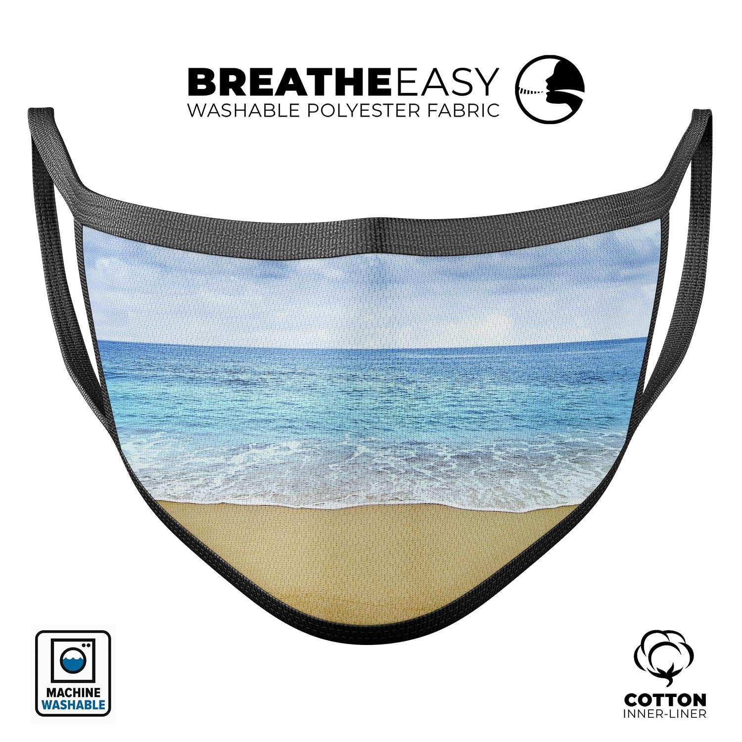 Calm Blue Sky and Sea Shore mouth cover, featuring a vibrant design, adjustable ear loops, and made from soft cotton for comfort.