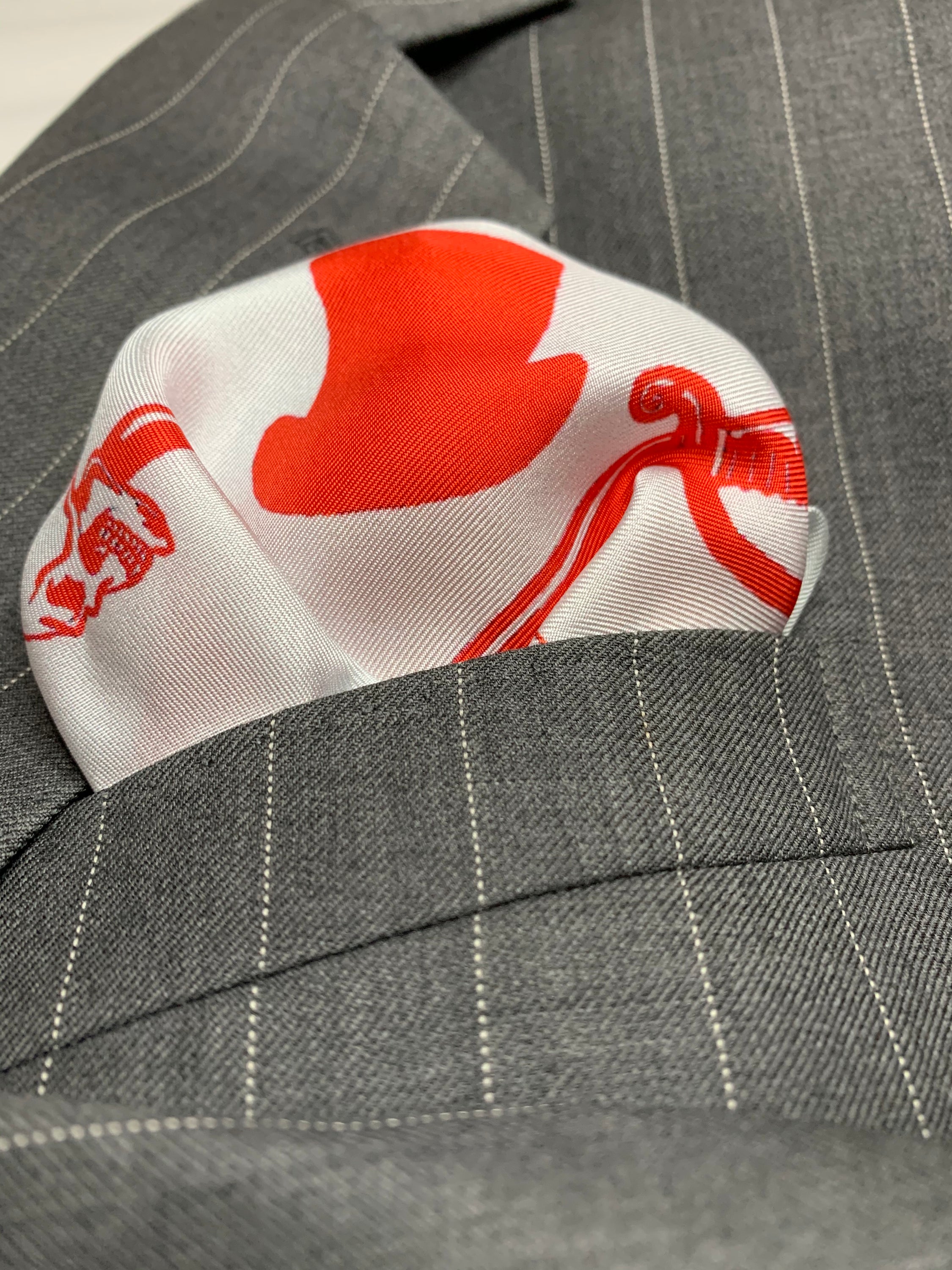 Canadian Rogue Pocket Square featuring a vibrant flag design in red, white, and Rogue colors, made from 100% silk.