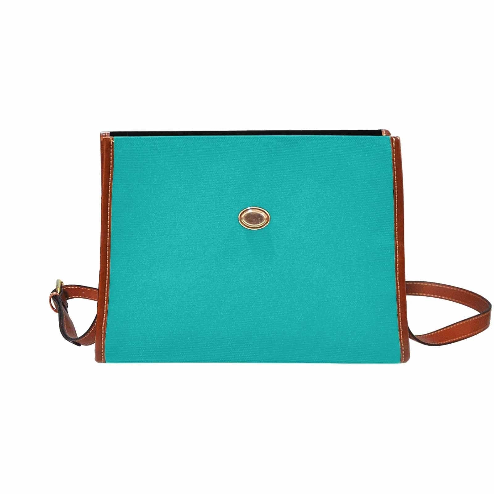 Stylish greenish blue canvas bag with brown shoulder strap, featuring two interior pockets and a zipper pocket.