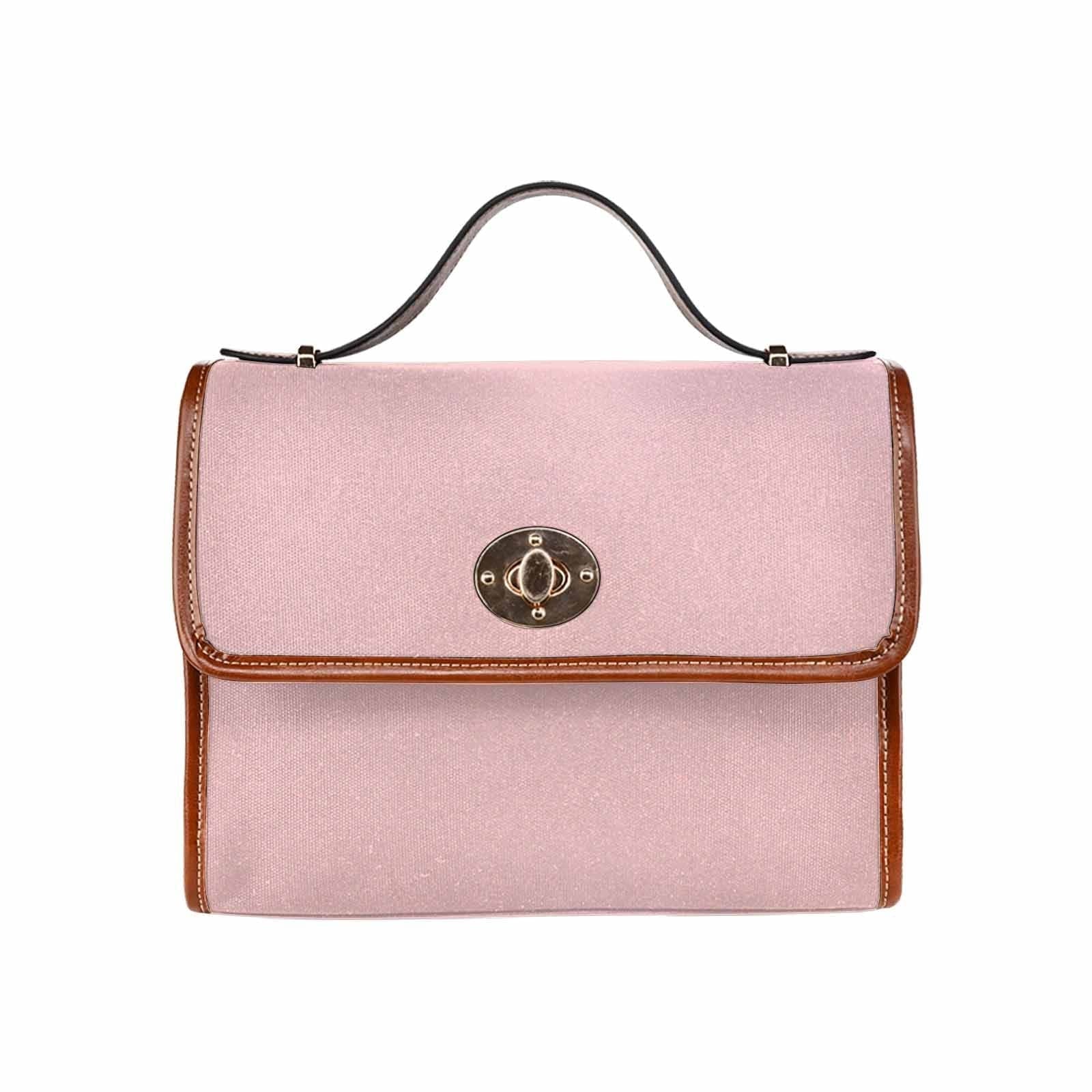 Canvas Bag in Rose Quartz Red with brown strap, featuring waterproof material and adjustable shoulder strap.