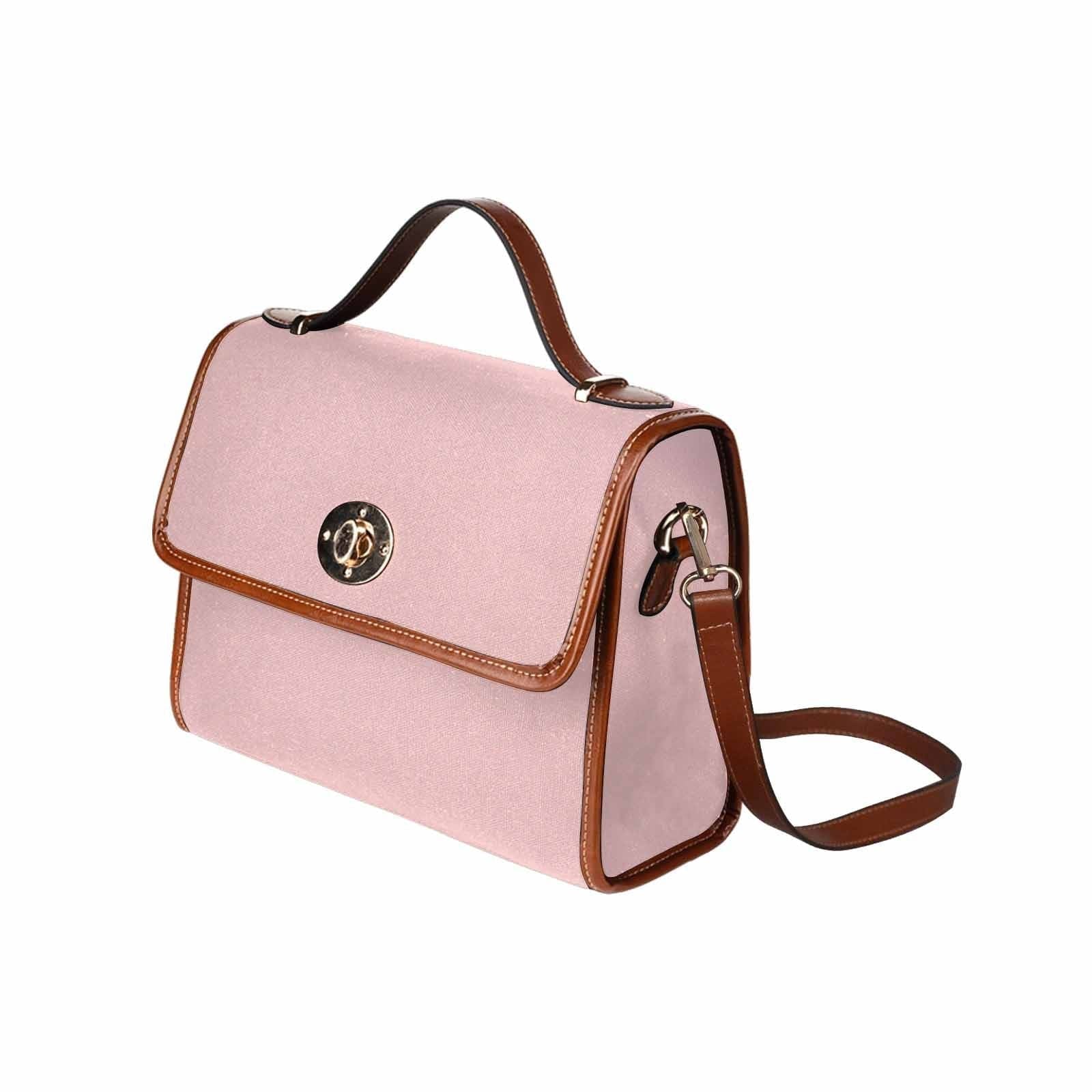 Canvas Bag in Rose Quartz Red with brown strap, featuring waterproof material and adjustable shoulder strap.