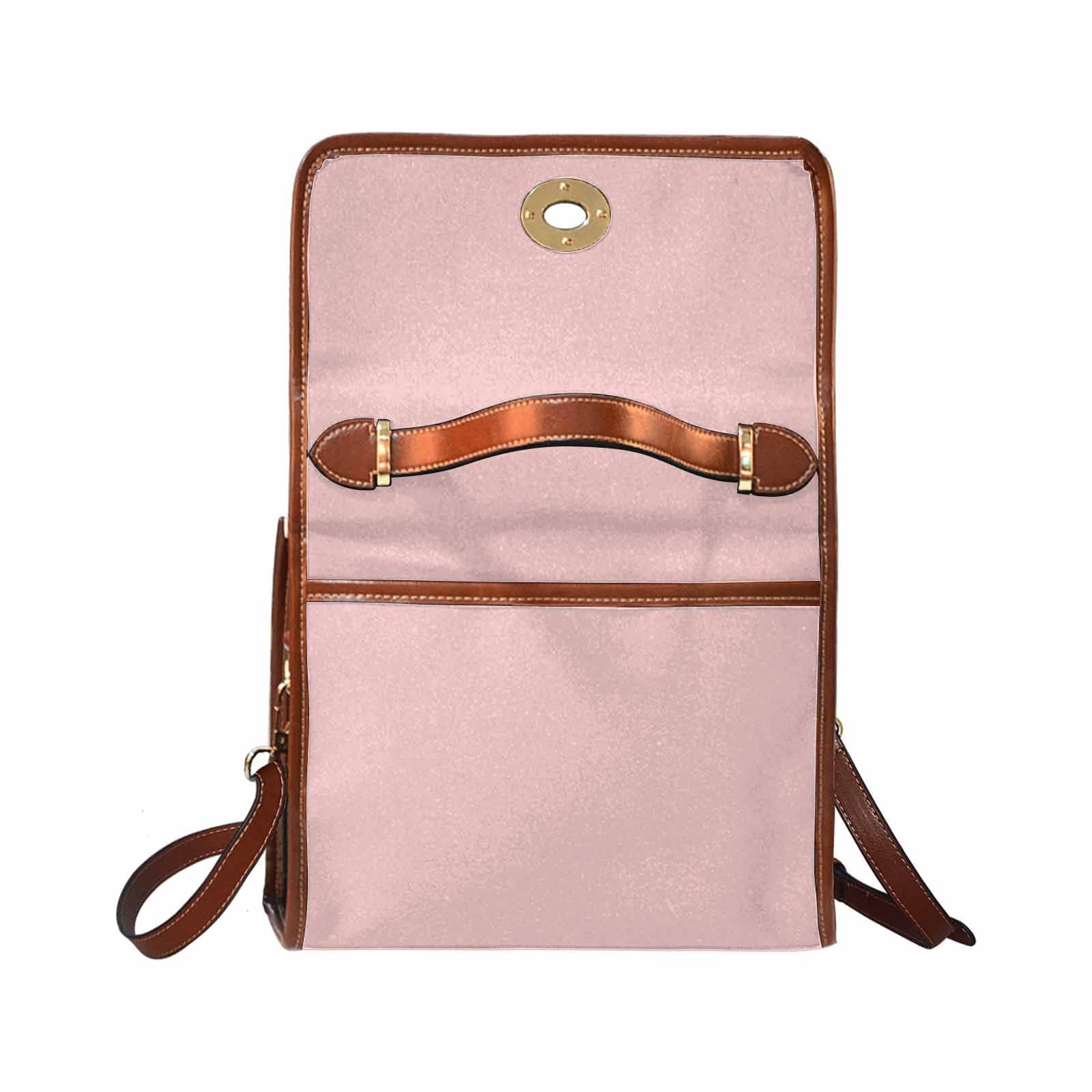 Canvas Bag in Rose Quartz Red with brown strap, featuring waterproof material and adjustable shoulder strap.