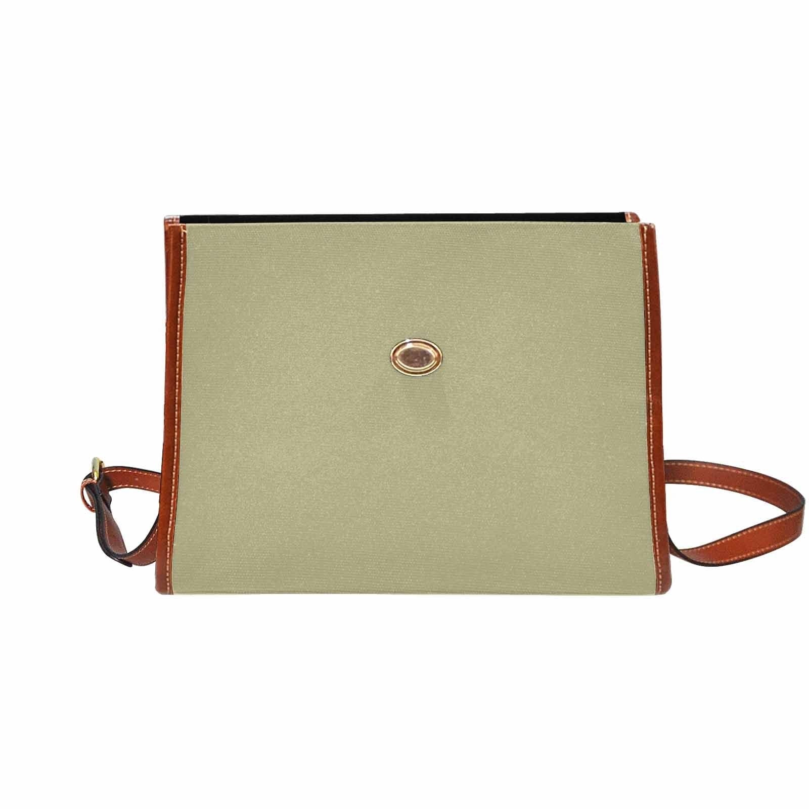 Sage green canvas bag with brown strap, featuring two interior pockets and a zipper pocket, perfect for versatile use.