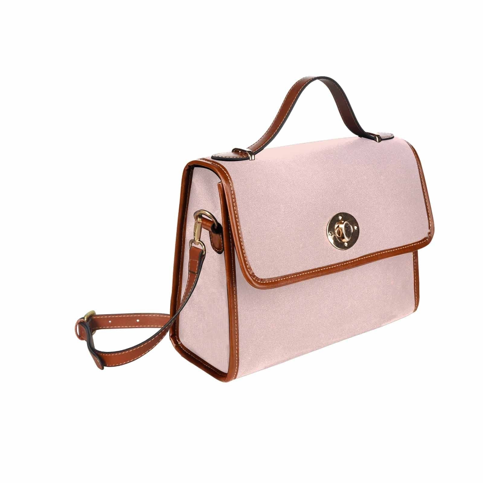 Stylish Canvas Bag in Scallop Seashell Pink with brown strap, featuring two interior pockets and a removable adjustable shoulder strap.