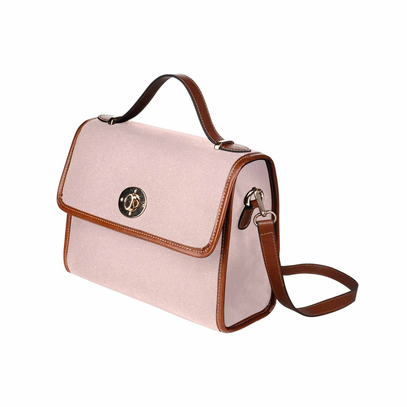 Stylish Canvas Bag in Scallop Seashell Pink with brown strap, featuring two interior pockets and a removable adjustable shoulder strap.