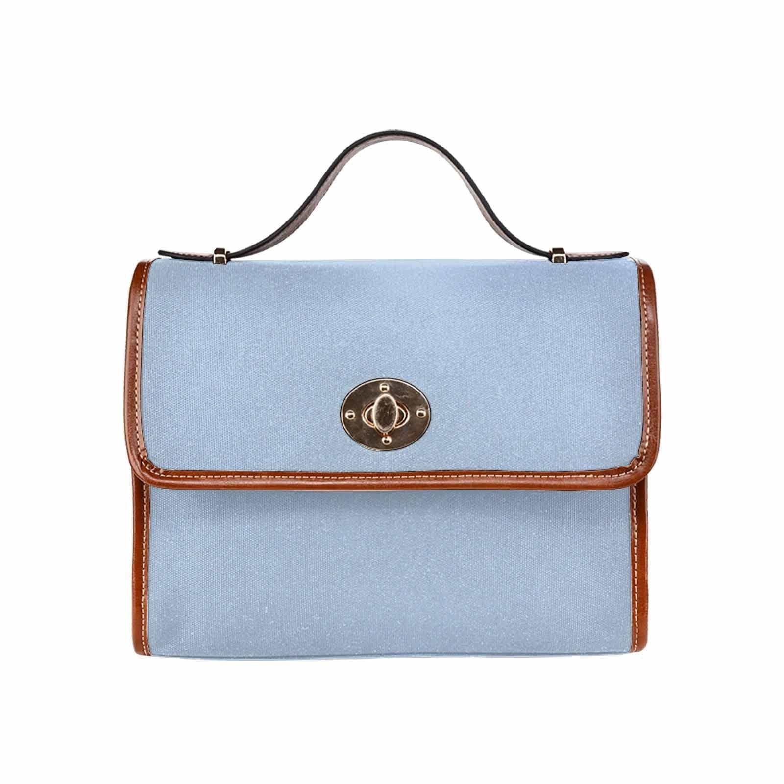 Serenity Blue Canvas Bag with brown strap, showcasing its waterproof material and stylish design.