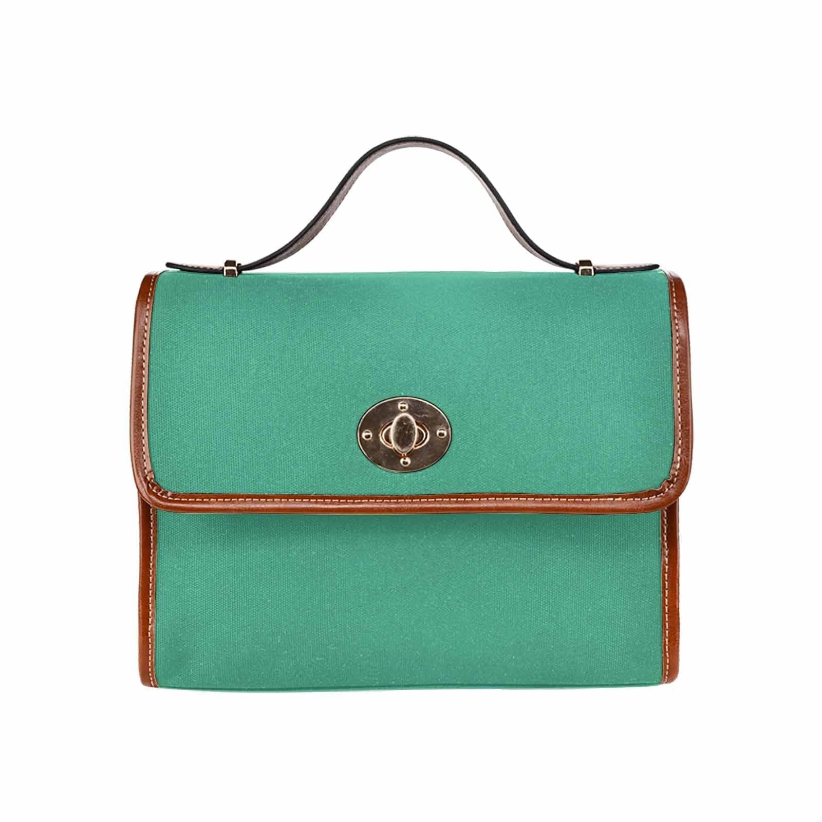 Spearmint Green Canvas Bag with brown strap, featuring two interior pockets and a removable adjustable shoulder strap.