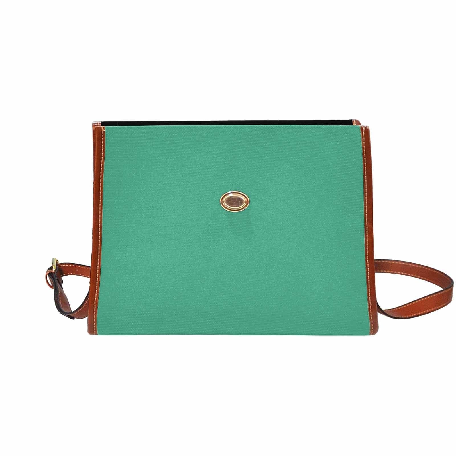 Spearmint Green Canvas Bag with brown strap, featuring two interior pockets and a removable adjustable shoulder strap.