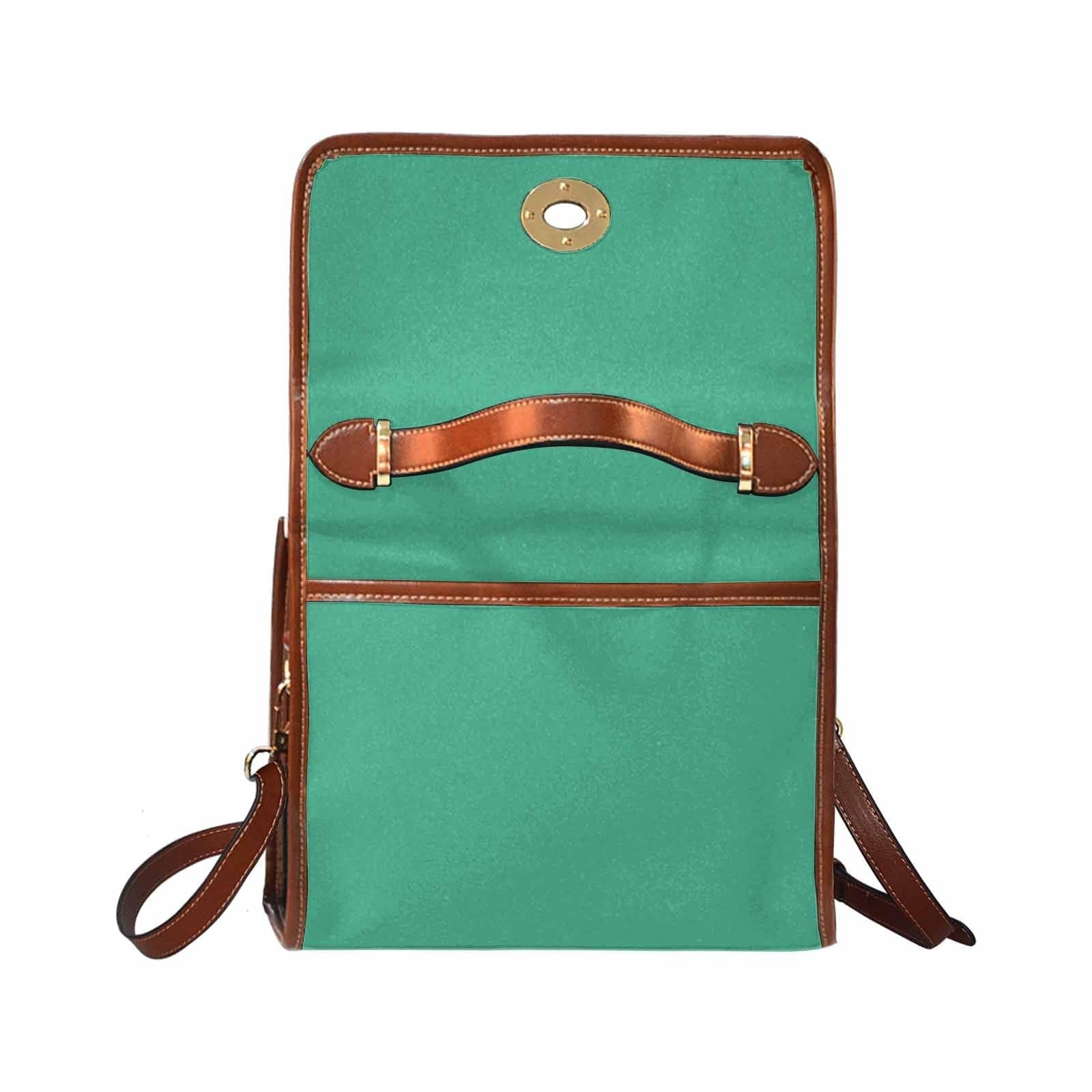 Spearmint Green Canvas Bag with brown strap, featuring two interior pockets and a removable adjustable shoulder strap.