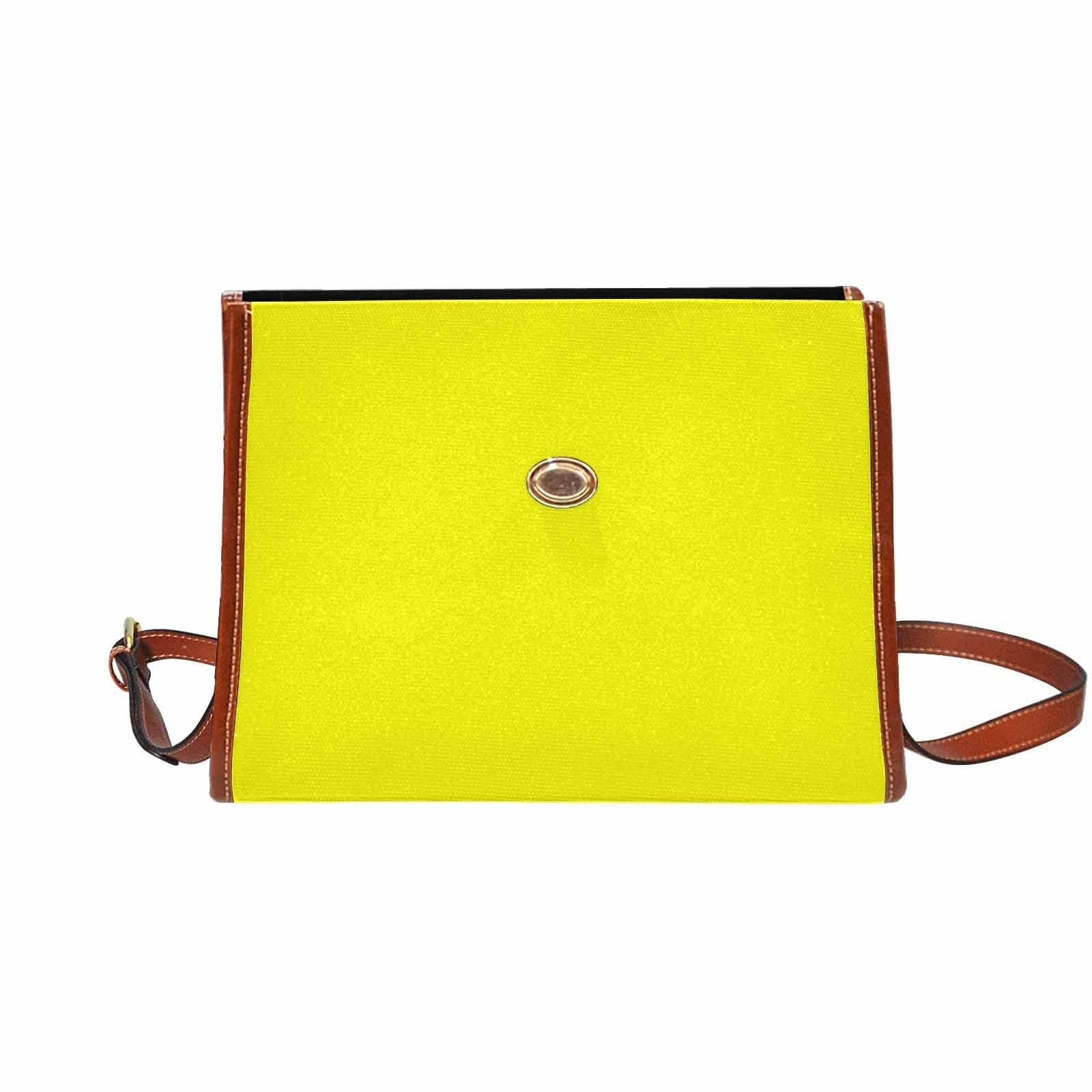 A vibrant yellow canvas bag with a brown adjustable shoulder strap, featuring two interior pockets and a zipper pocket, perfect for everyday use.