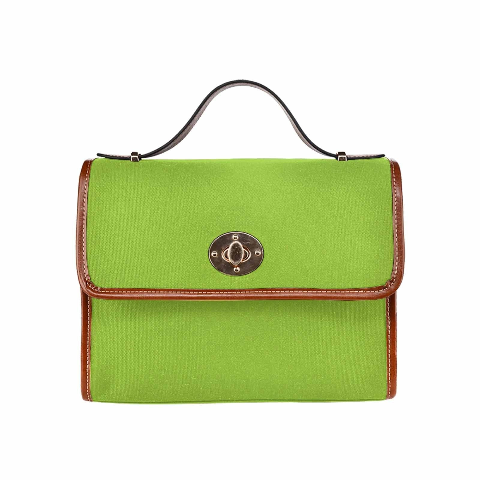 Yellow green canvas bag with brown strap, featuring two interior pockets and adjustable shoulder strap, perfect for various uses.