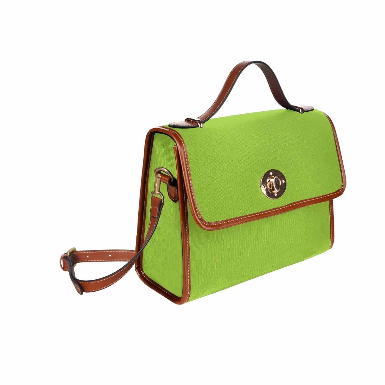 Yellow green canvas bag with brown strap, featuring two interior pockets and adjustable shoulder strap, perfect for various uses.