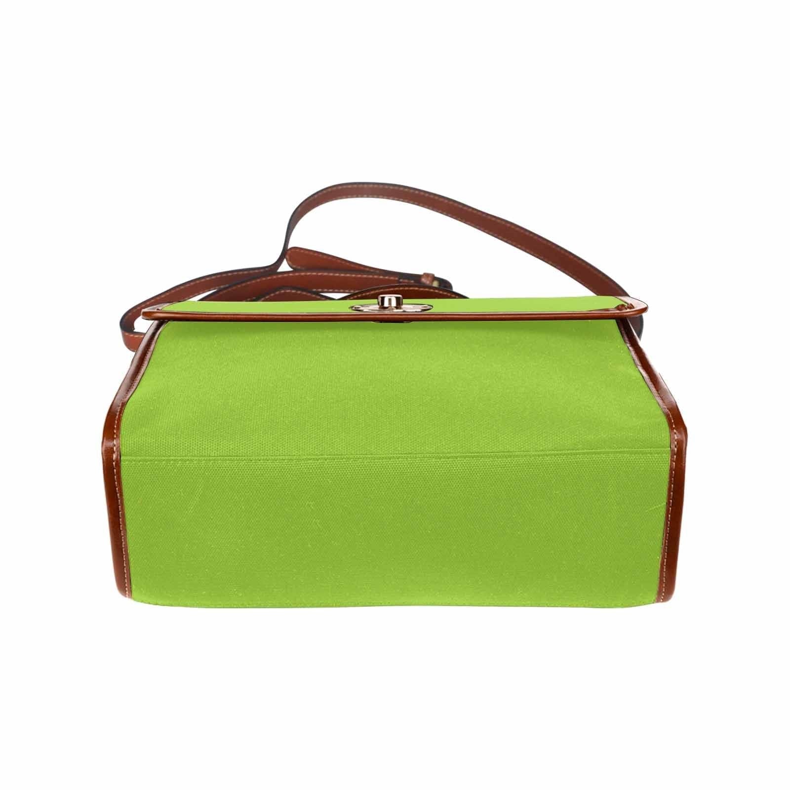 Yellow green canvas bag with brown strap, featuring two interior pockets and adjustable shoulder strap, perfect for various uses.