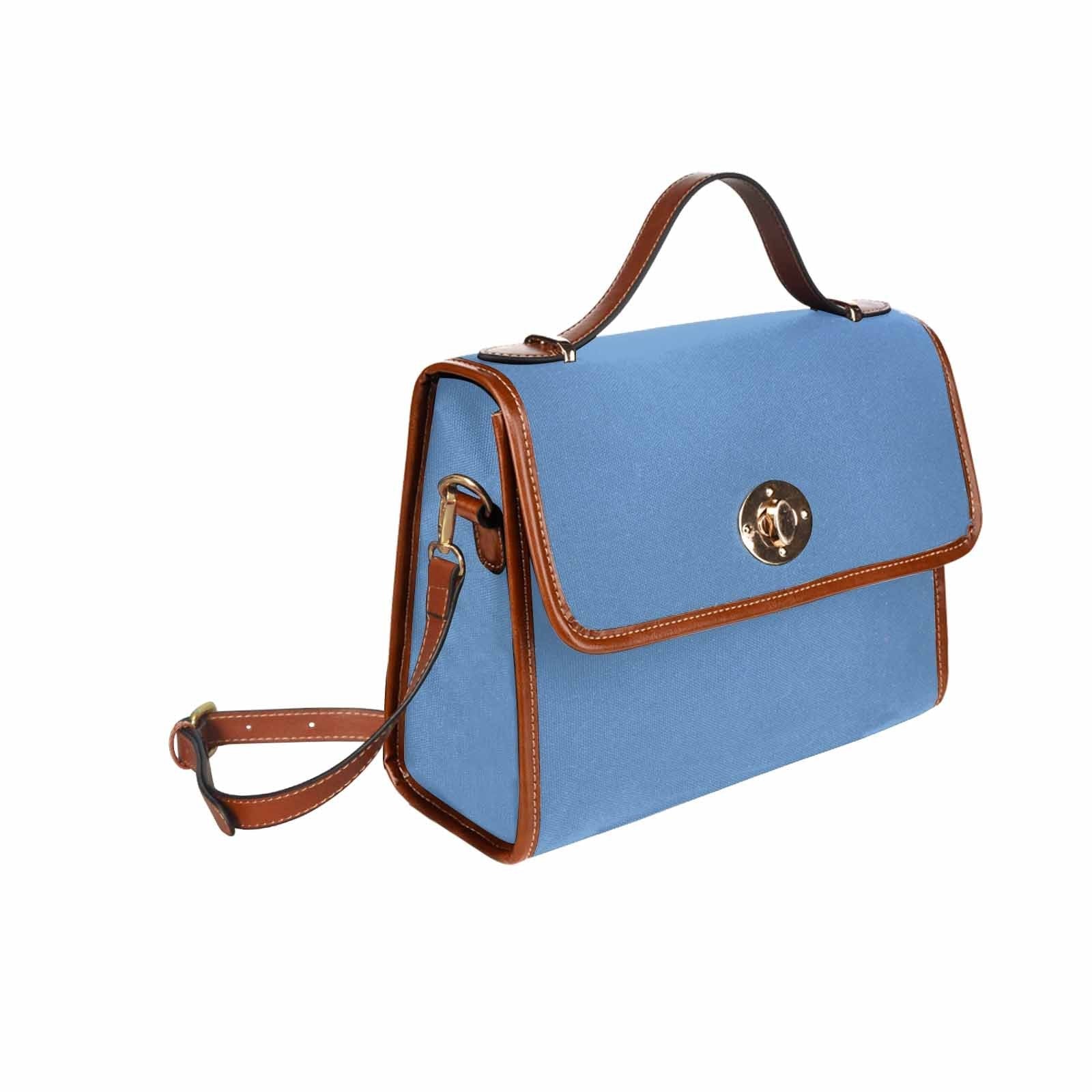 Canvas Handbag in blue gray with brown crossbody strap, showcasing waterproof material and stylish design.