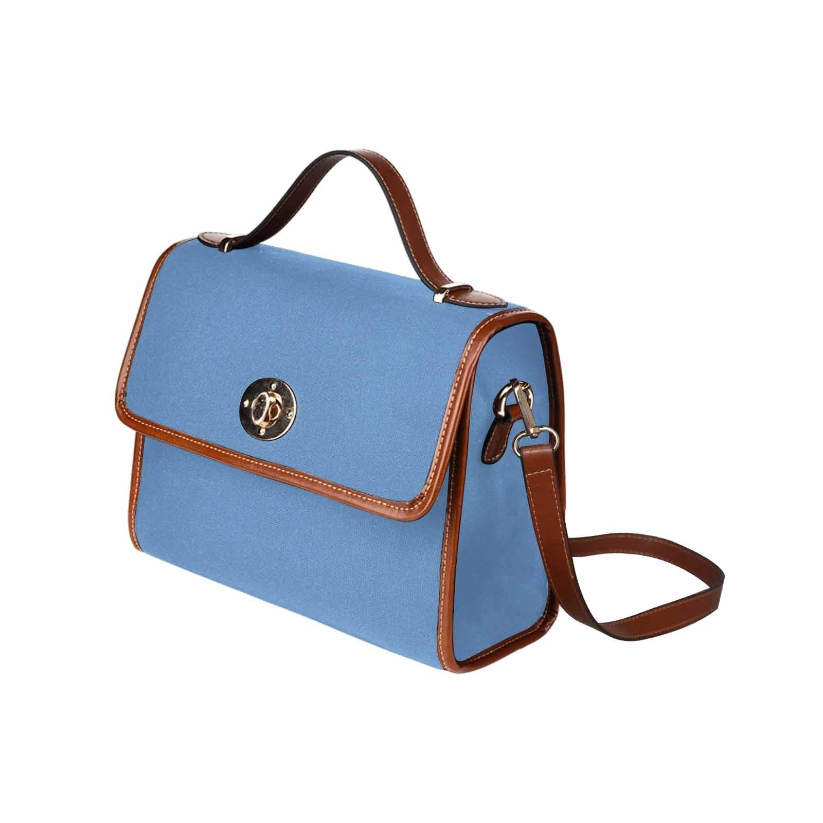 Canvas Handbag in blue gray with brown crossbody strap, showcasing waterproof material and stylish design.