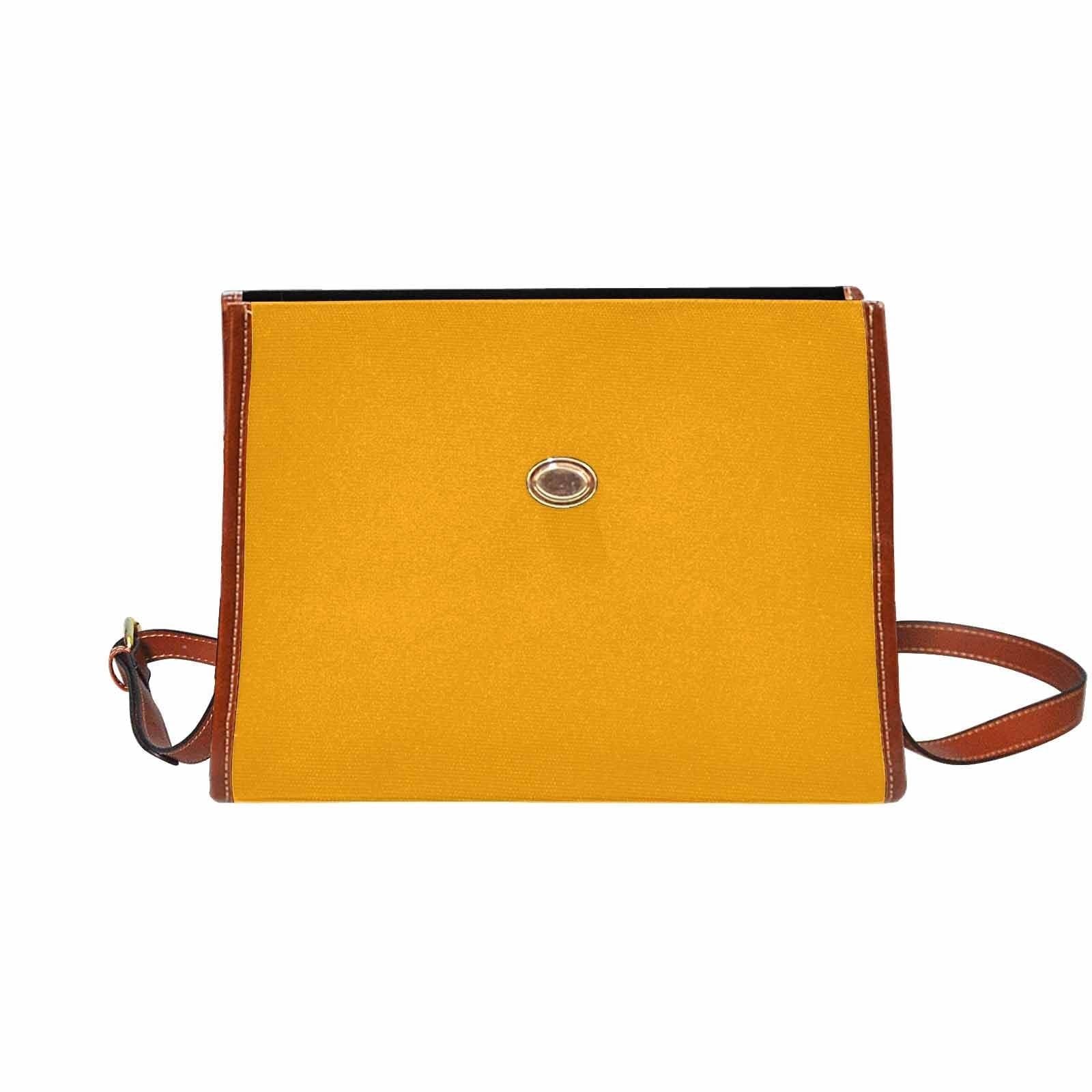 Bright orange canvas handbag with a brown crossbody strap, featuring two interior pockets and a zipper pocket.