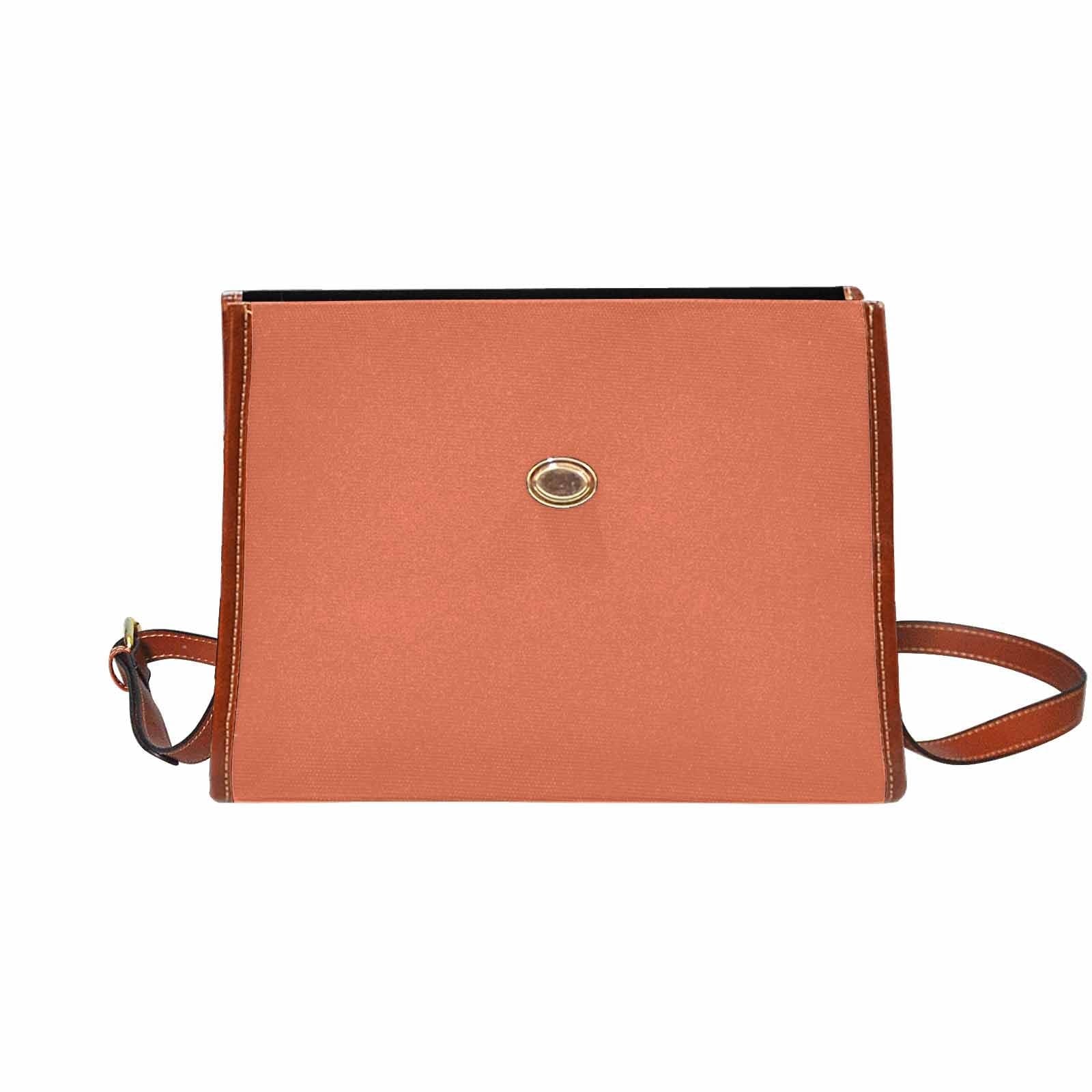 Stylish burnt sienna red canvas handbag with brown crossbody strap, featuring two interior pockets and a zipper pocket.