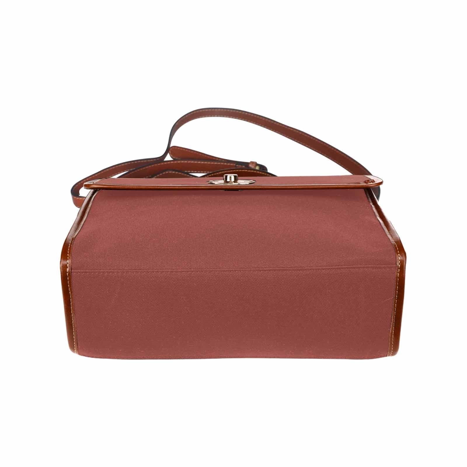 Cognac red waterproof canvas handbag with brown crossbody strap, featuring two interior pockets and a zipper pocket.