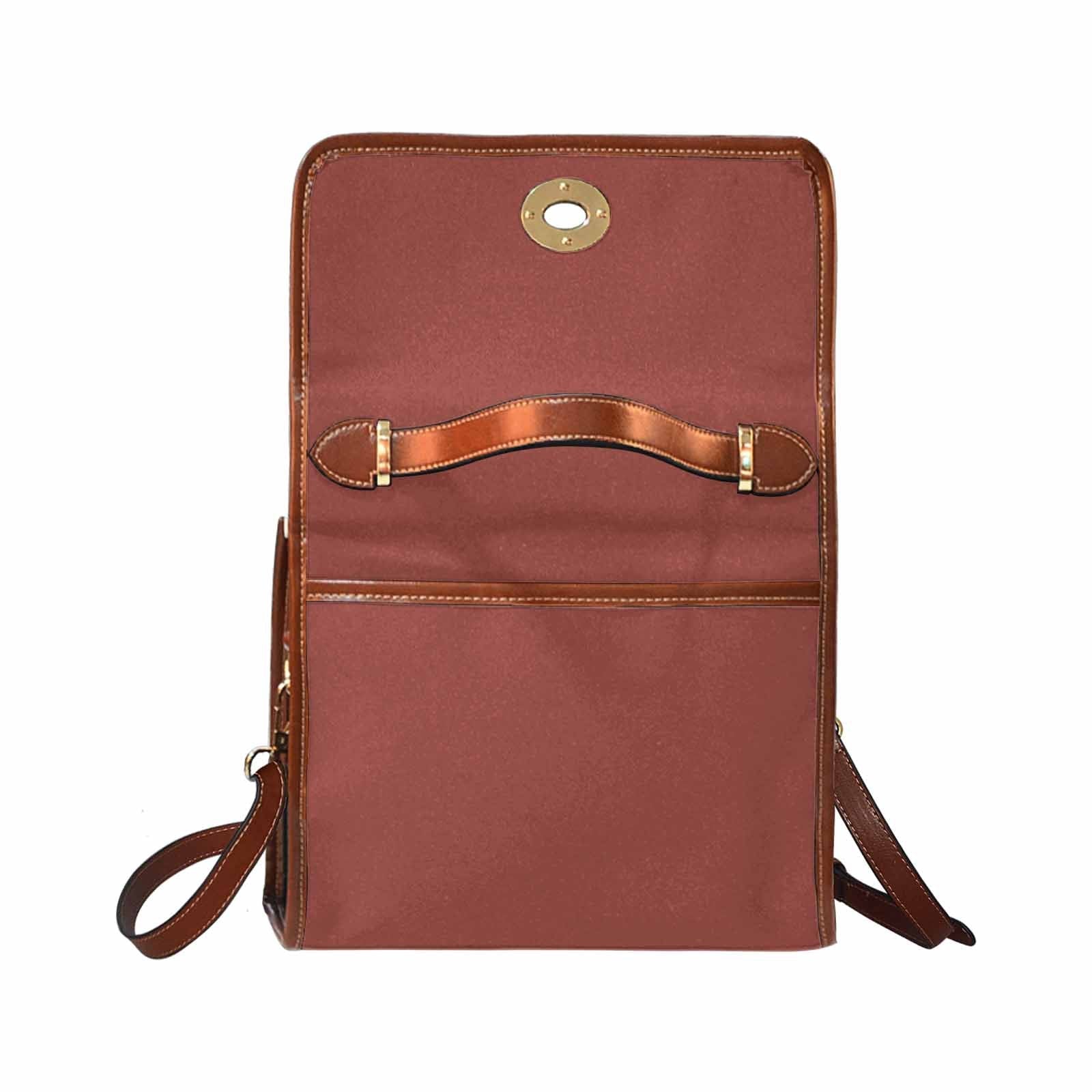 Cognac red waterproof canvas handbag with brown crossbody strap, featuring two interior pockets and a zipper pocket.