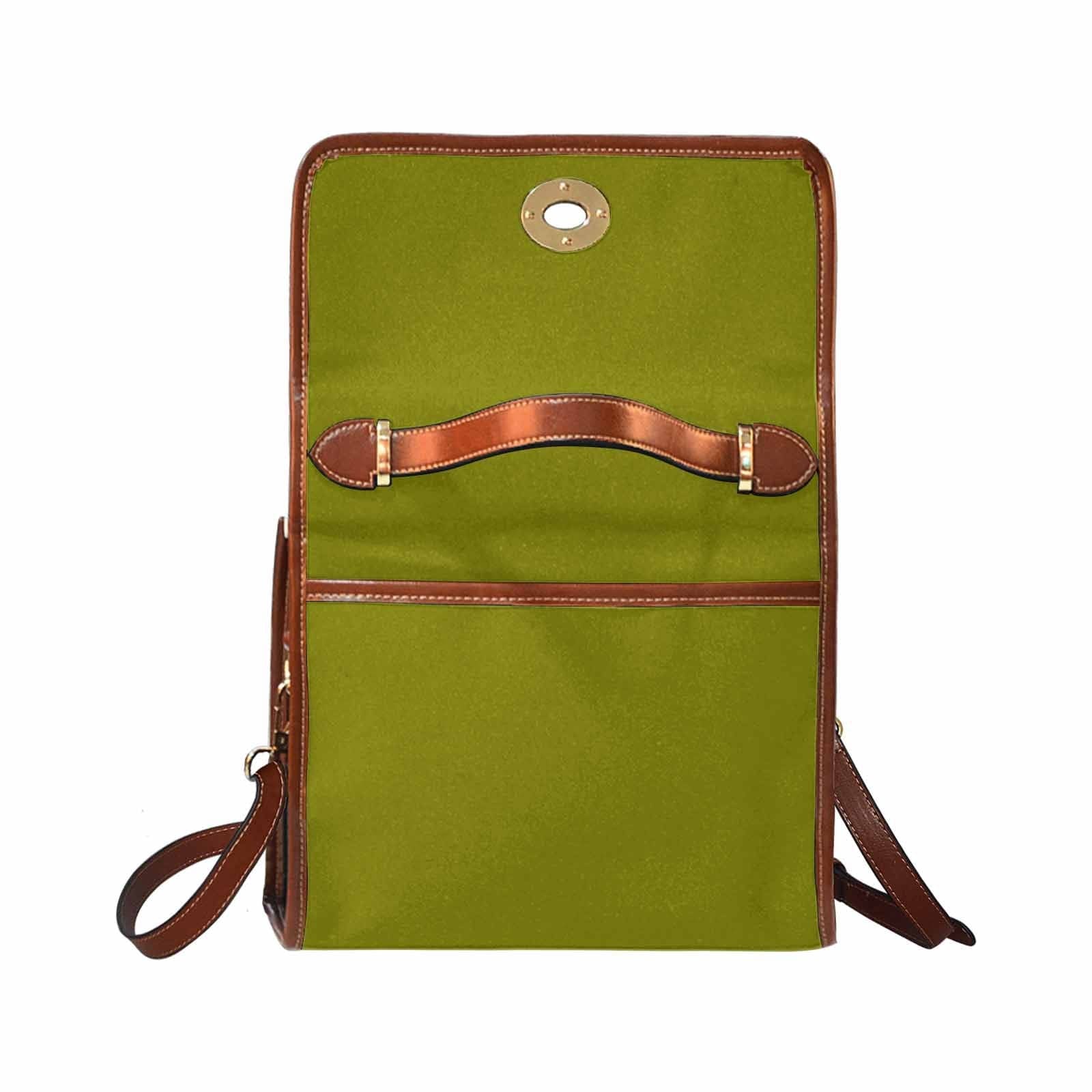 Dark olive green canvas handbag with brown crossbody strap, featuring two interior pockets and a zipper pocket.