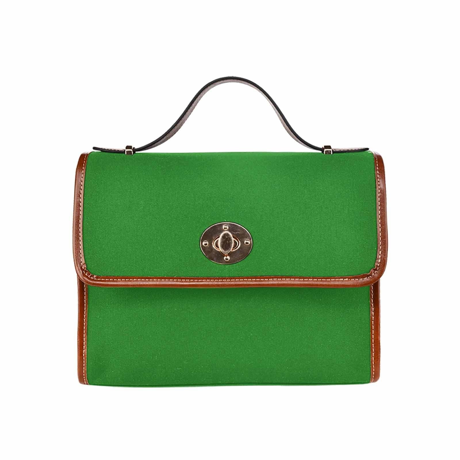 Forest green canvas handbag with brown crossbody strap, featuring two interior pockets and a zipper pocket.