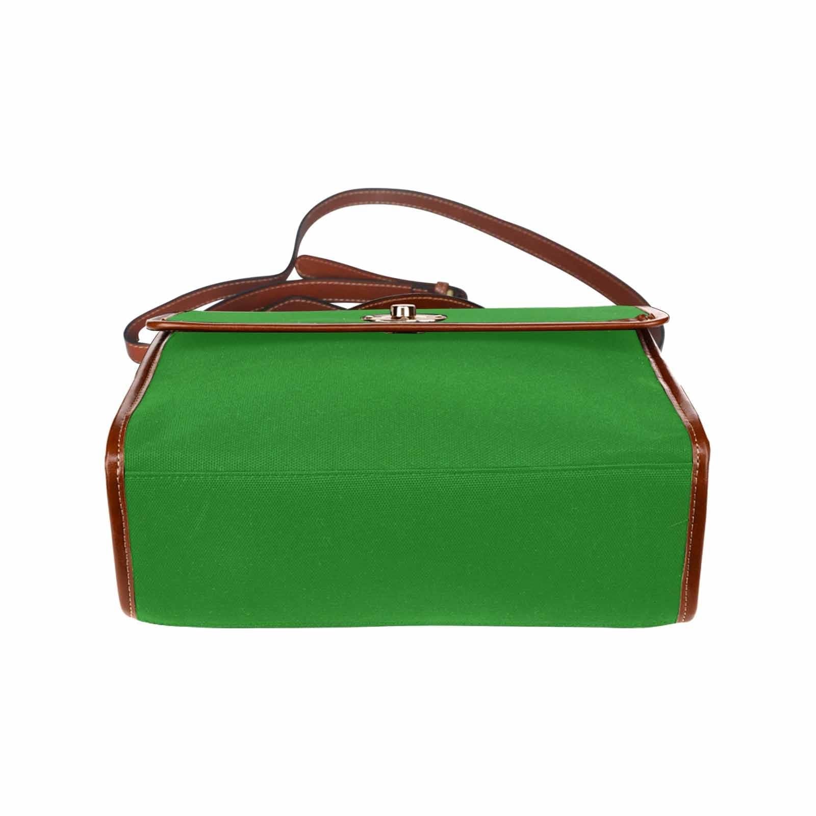 Forest green canvas handbag with brown crossbody strap, featuring two interior pockets and a zipper pocket.