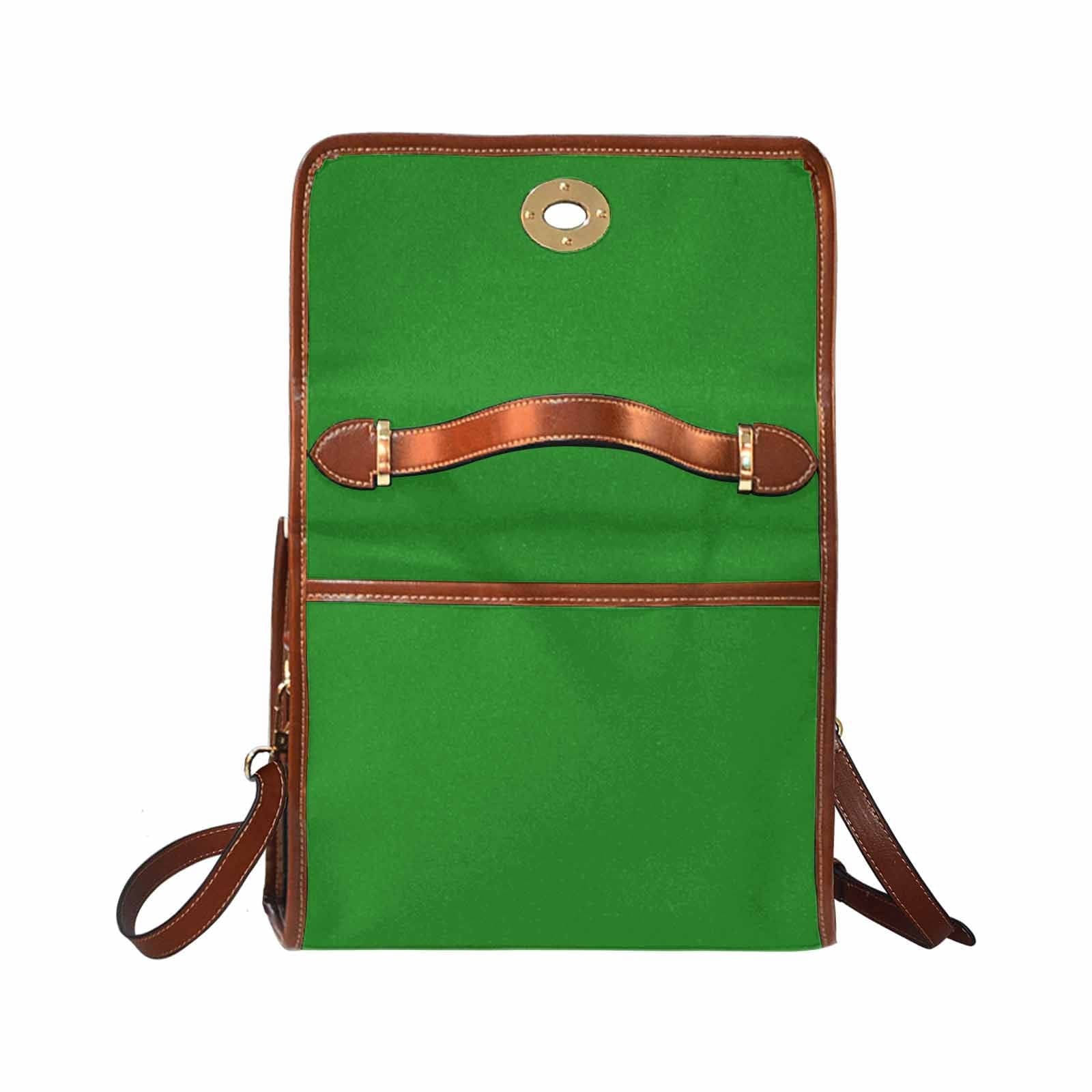 Forest green canvas handbag with brown crossbody strap, featuring two interior pockets and a zipper pocket.