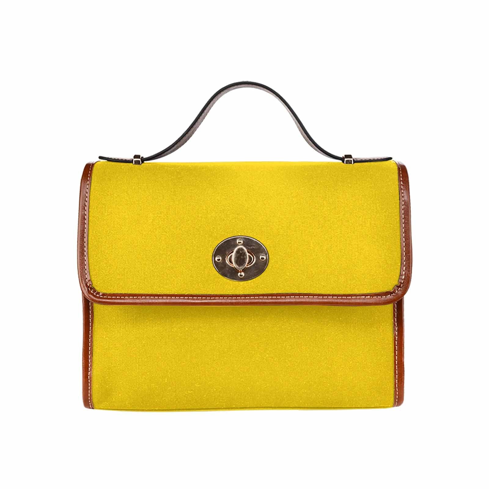 Stylish gold yellow canvas handbag with brown crossbody strap, featuring waterproof material and interior pockets.