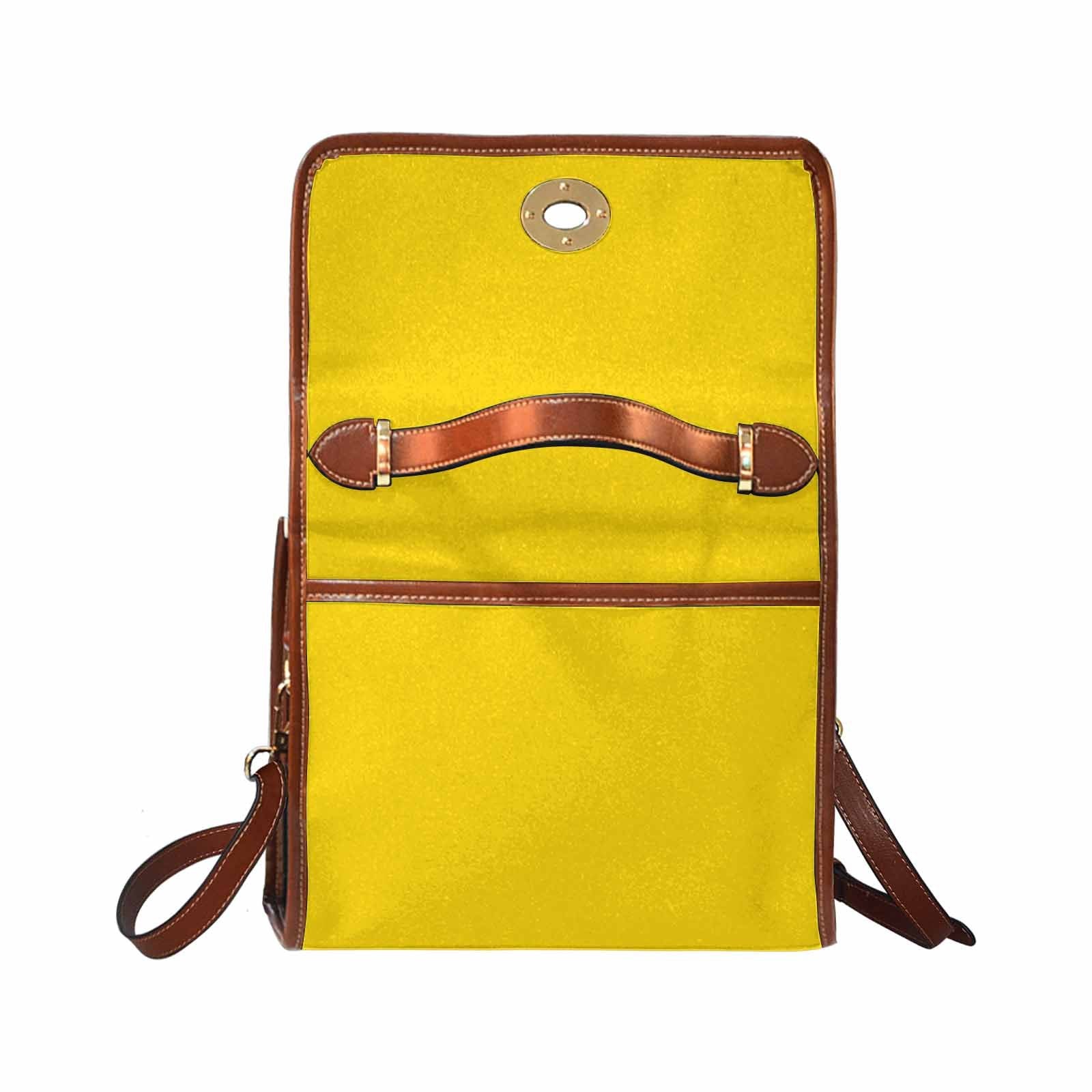 Stylish gold yellow canvas handbag with brown crossbody strap, featuring waterproof material and interior pockets.