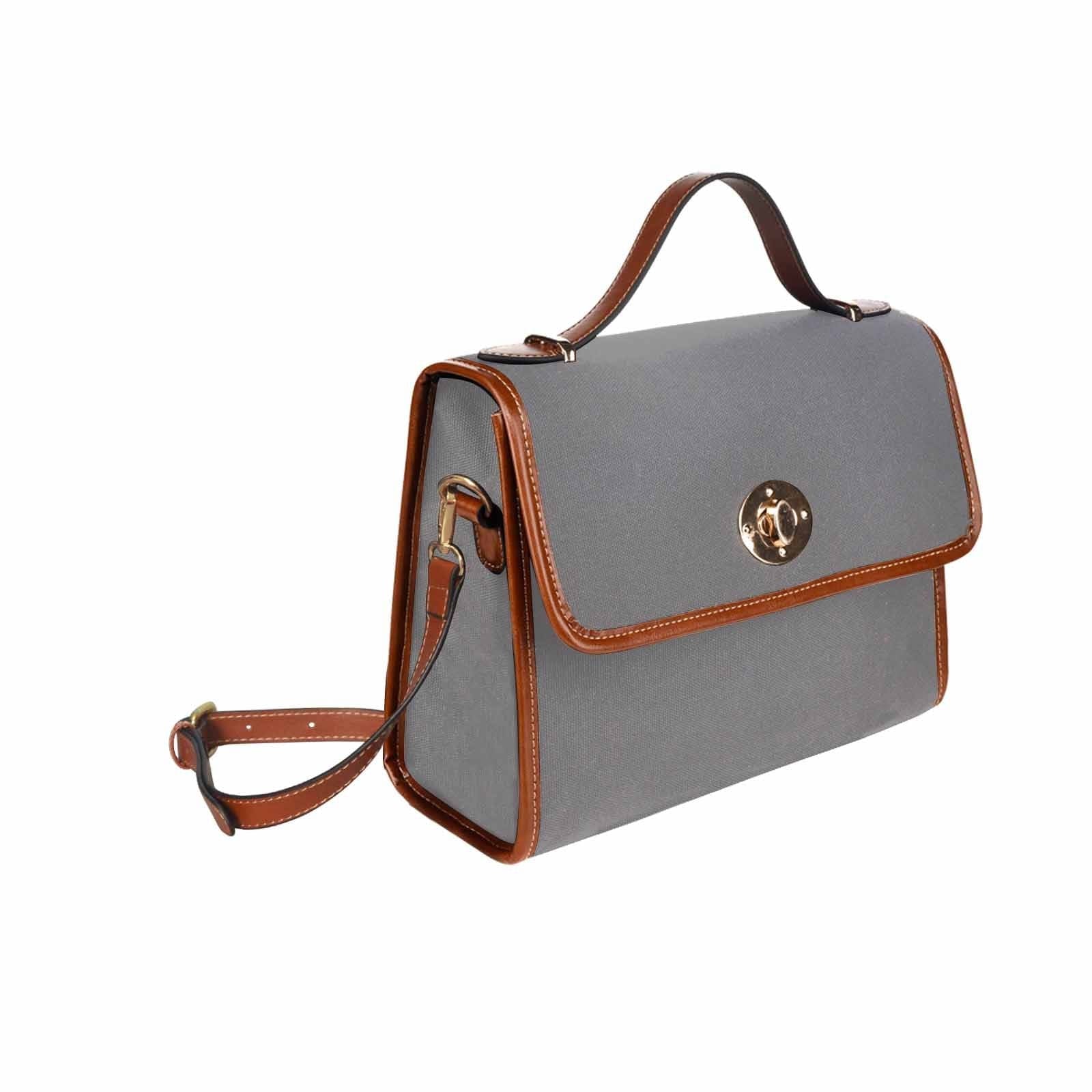 Gray waterproof canvas handbag with brown crossbody strap, featuring two interior pockets and a zipper pocket.