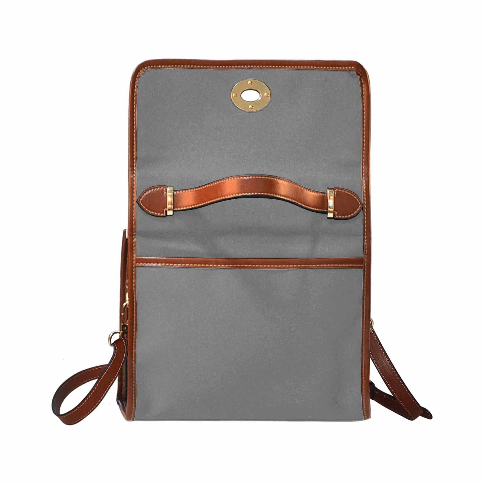 Gray waterproof canvas handbag with brown crossbody strap, featuring two interior pockets and a zipper pocket.