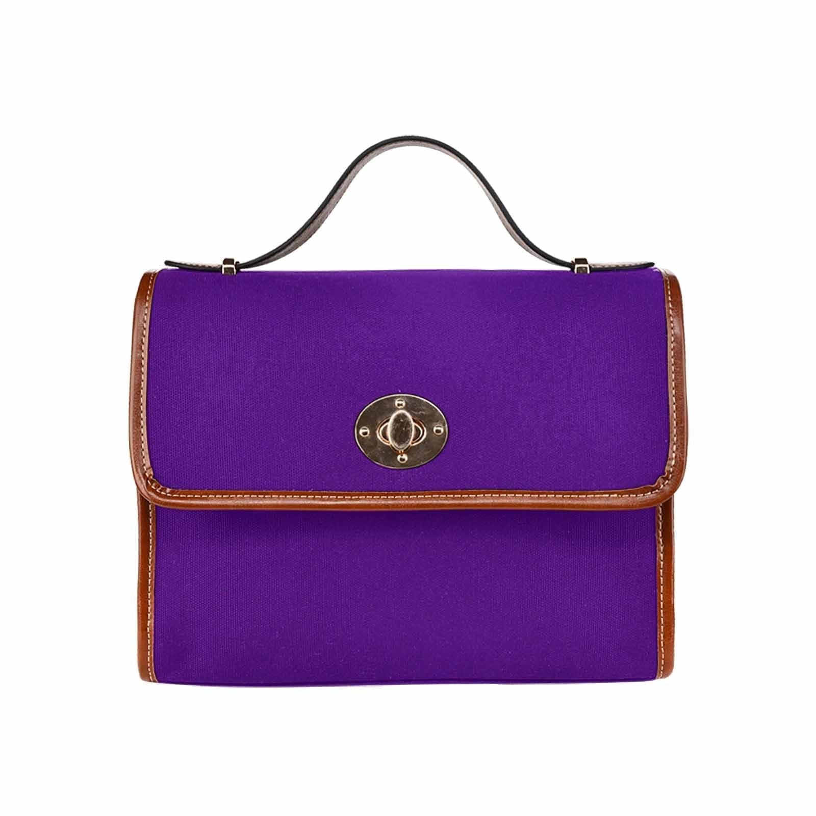 Indigo purple waterproof canvas handbag with brown crossbody strap, featuring two interior pockets and a zipper pocket.