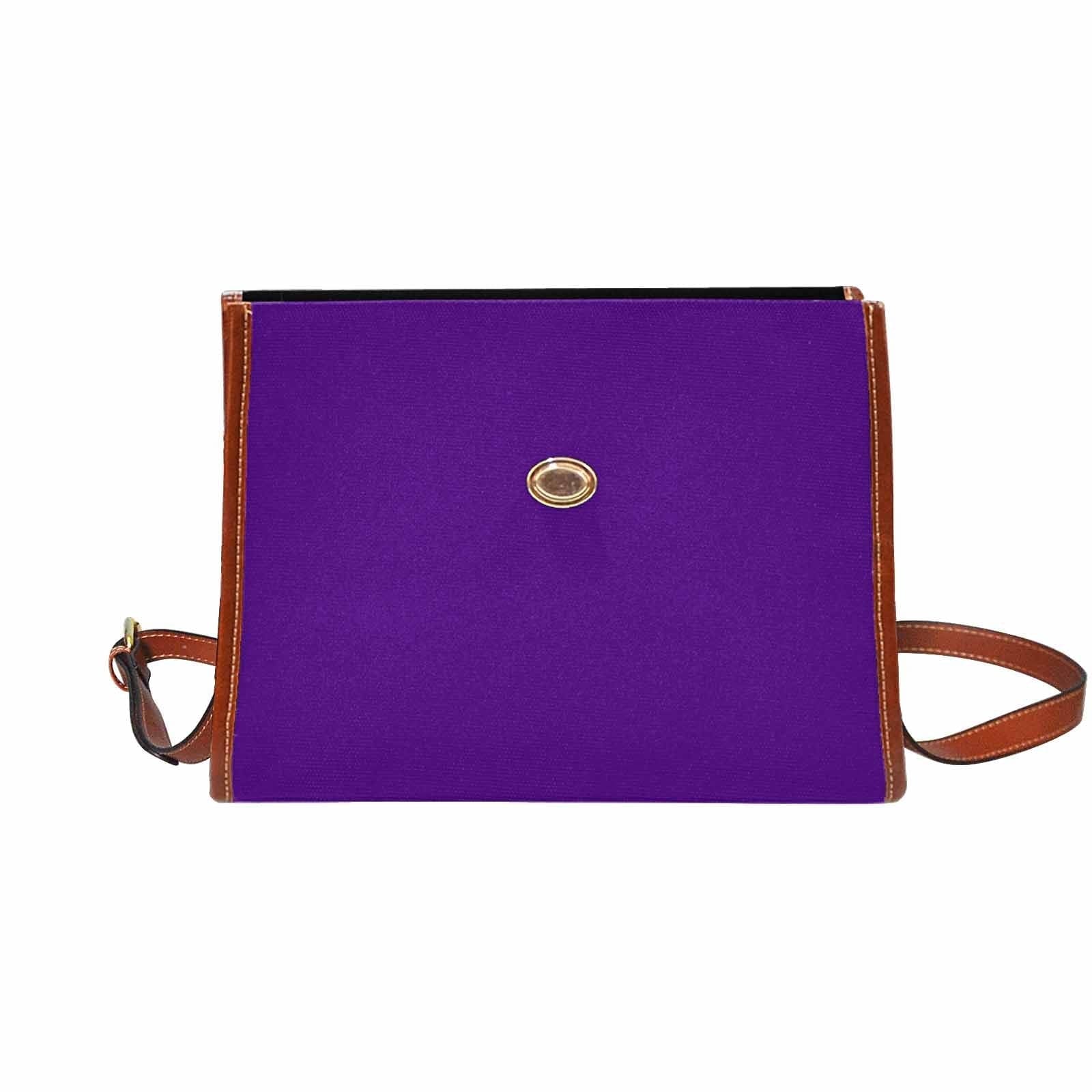 Indigo purple waterproof canvas handbag with brown crossbody strap, featuring two interior pockets and a zipper pocket.