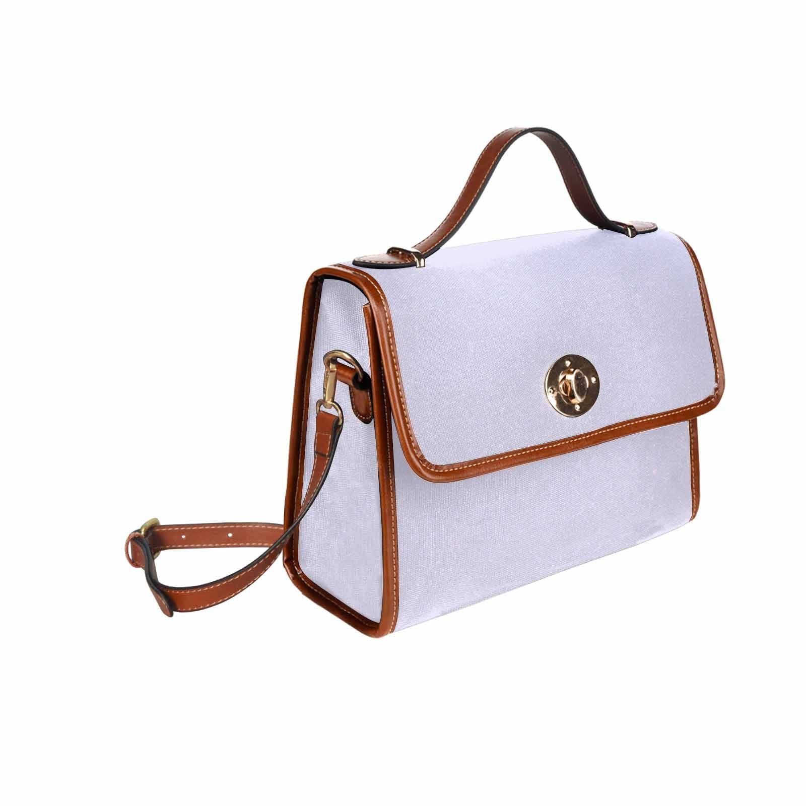 Lavender purple canvas handbag with brown crossbody strap, showcasing its stylish design and functional pockets.