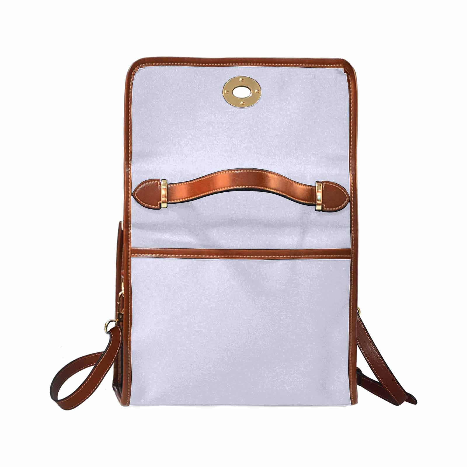 Lavender purple canvas handbag with brown crossbody strap, showcasing its stylish design and functional pockets.