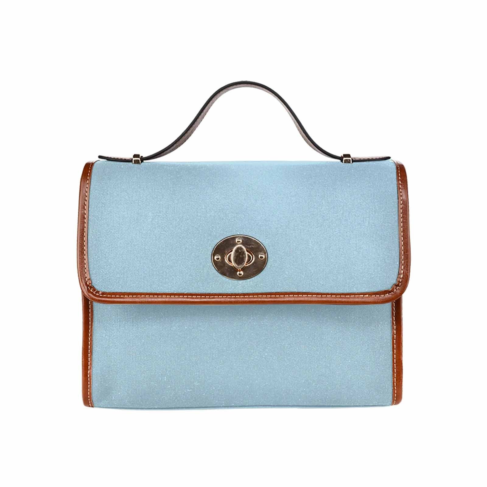 Light blue waterproof canvas handbag with brown crossbody strap, featuring two interior pockets and a zipper pocket.