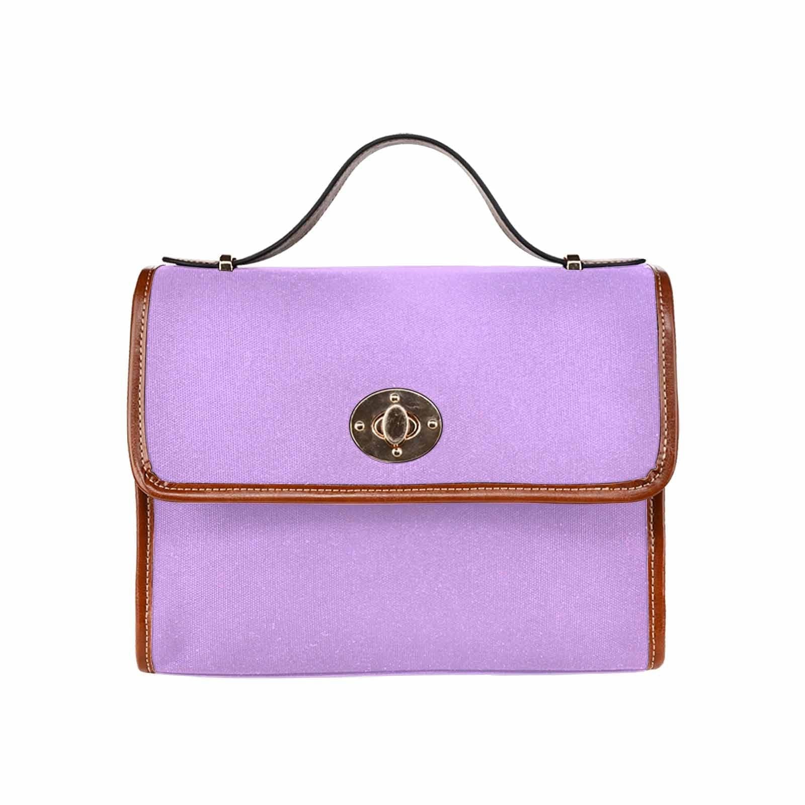 Mauve purple canvas handbag with brown crossbody strap, featuring two interior pockets and a zipper pocket.