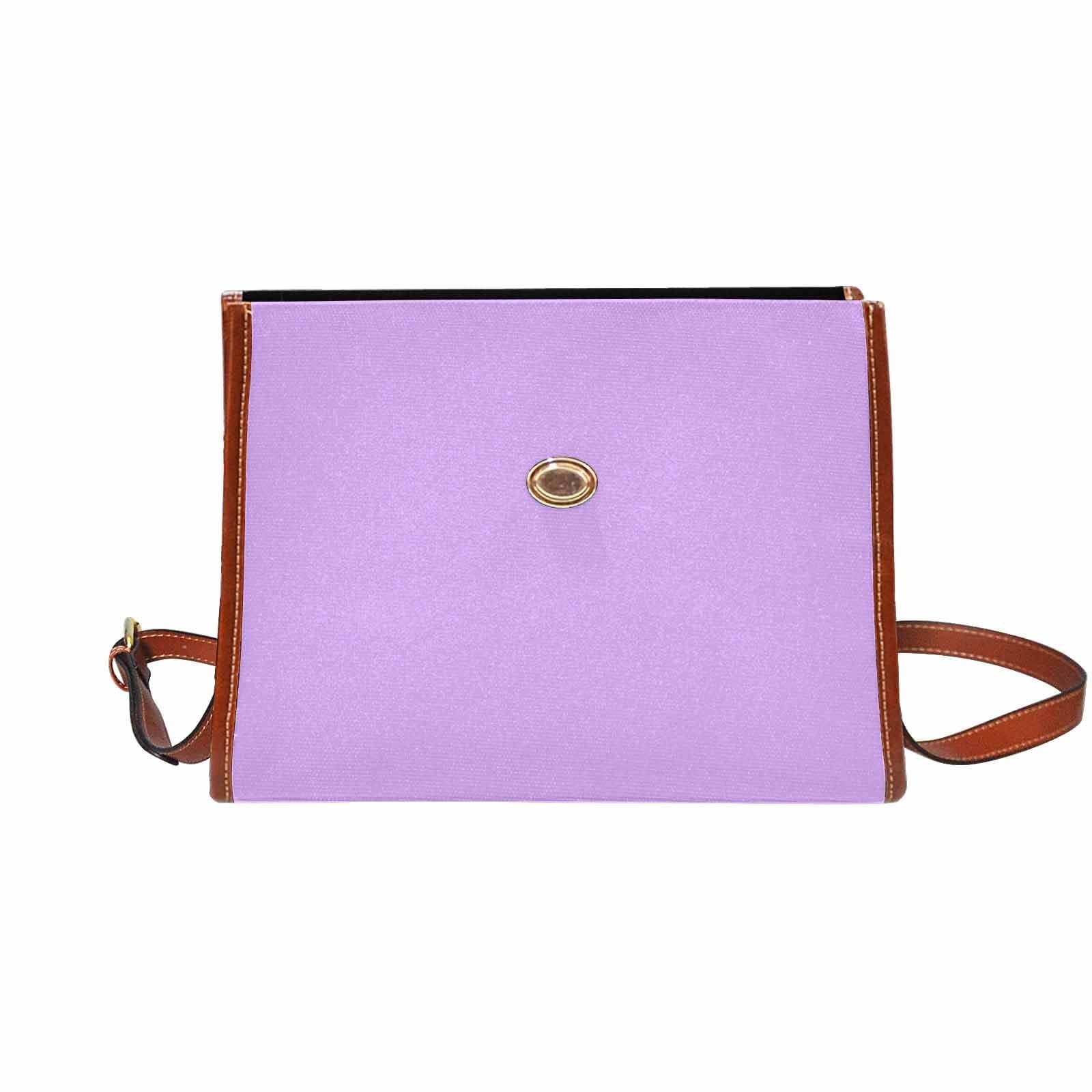 Mauve purple canvas handbag with brown crossbody strap, featuring two interior pockets and a zipper pocket.