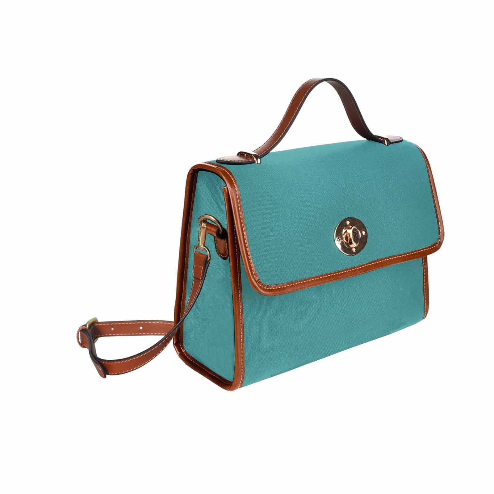 Mint blue waterproof canvas handbag with brown crossbody strap, featuring two interior pockets and a zipper pocket.