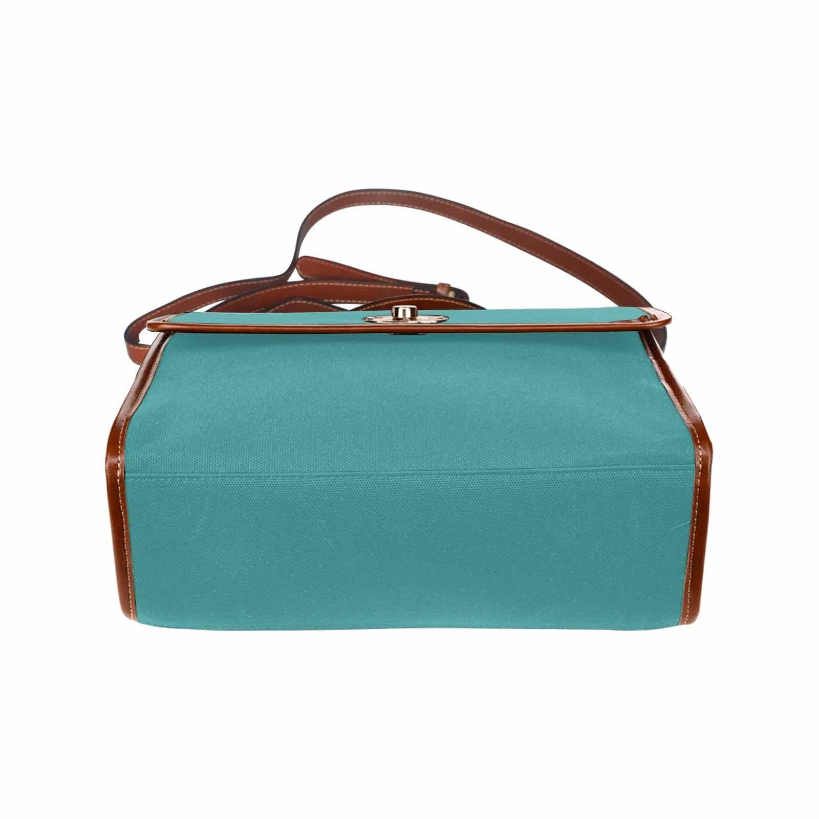 Mint blue waterproof canvas handbag with brown crossbody strap, featuring two interior pockets and a zipper pocket.