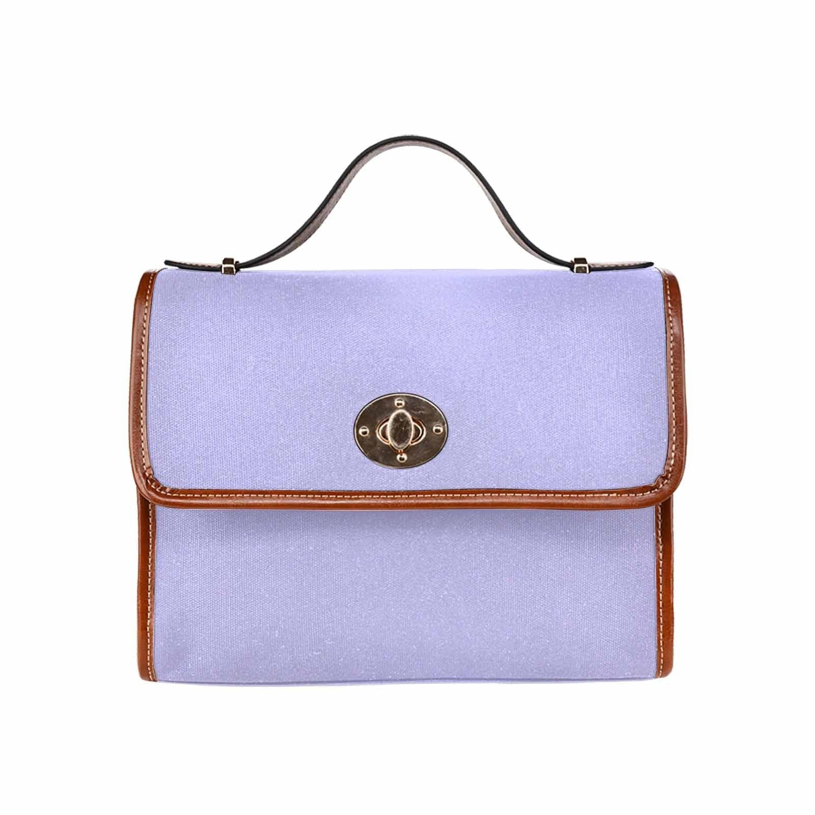 Stylish periwinkle purple canvas handbag with brown crossbody strap, showcasing its durable design and spacious interior.