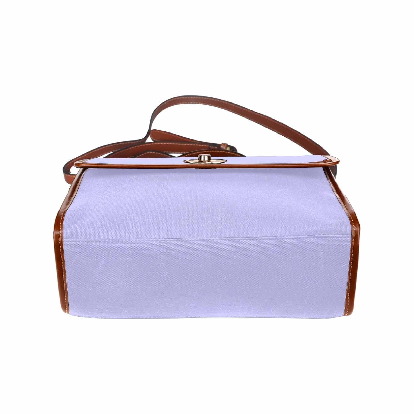 Stylish periwinkle purple canvas handbag with brown crossbody strap, showcasing its durable design and spacious interior.