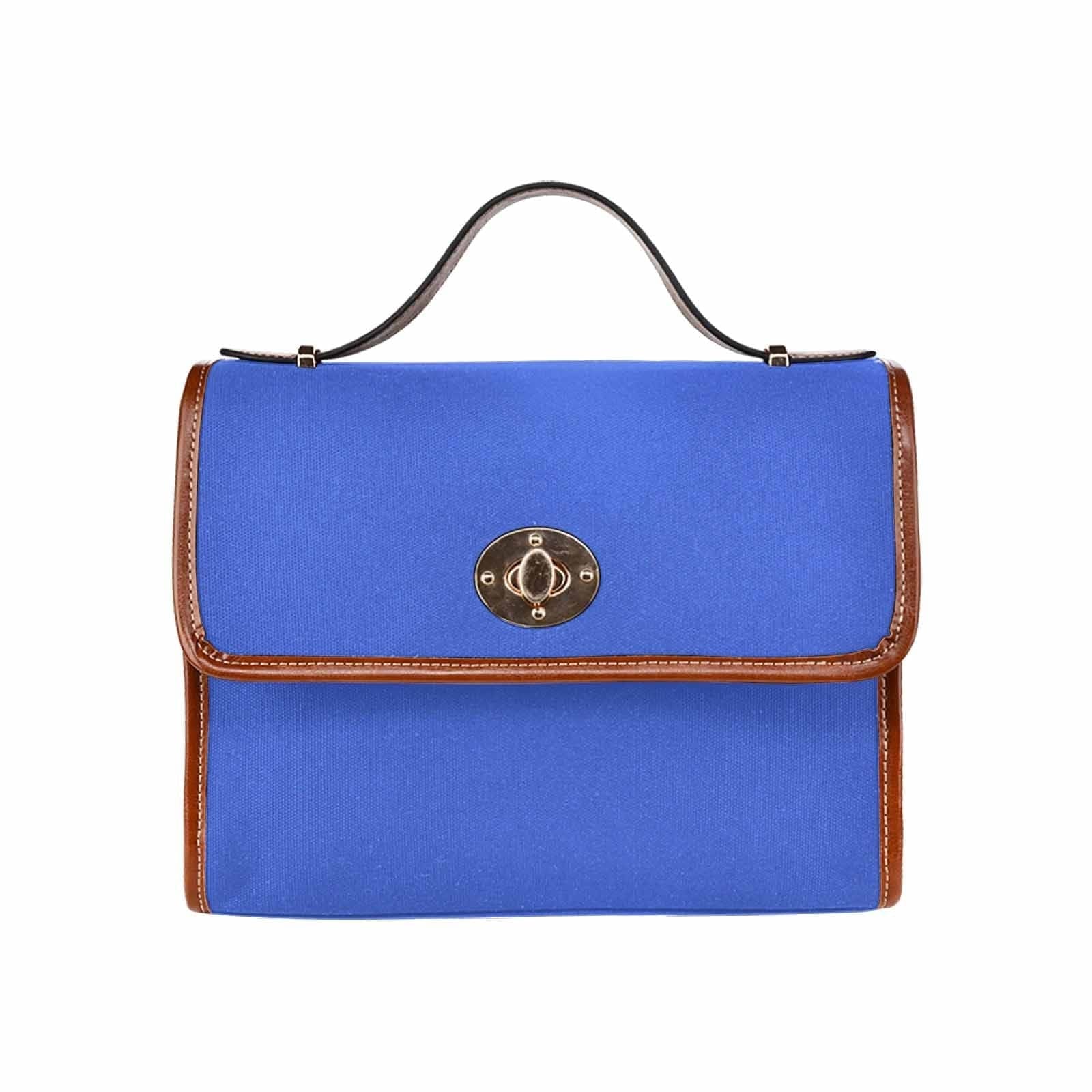 Royal Blue Canvas Handbag with brown crossbody strap, showcasing its waterproof material and stylish design.