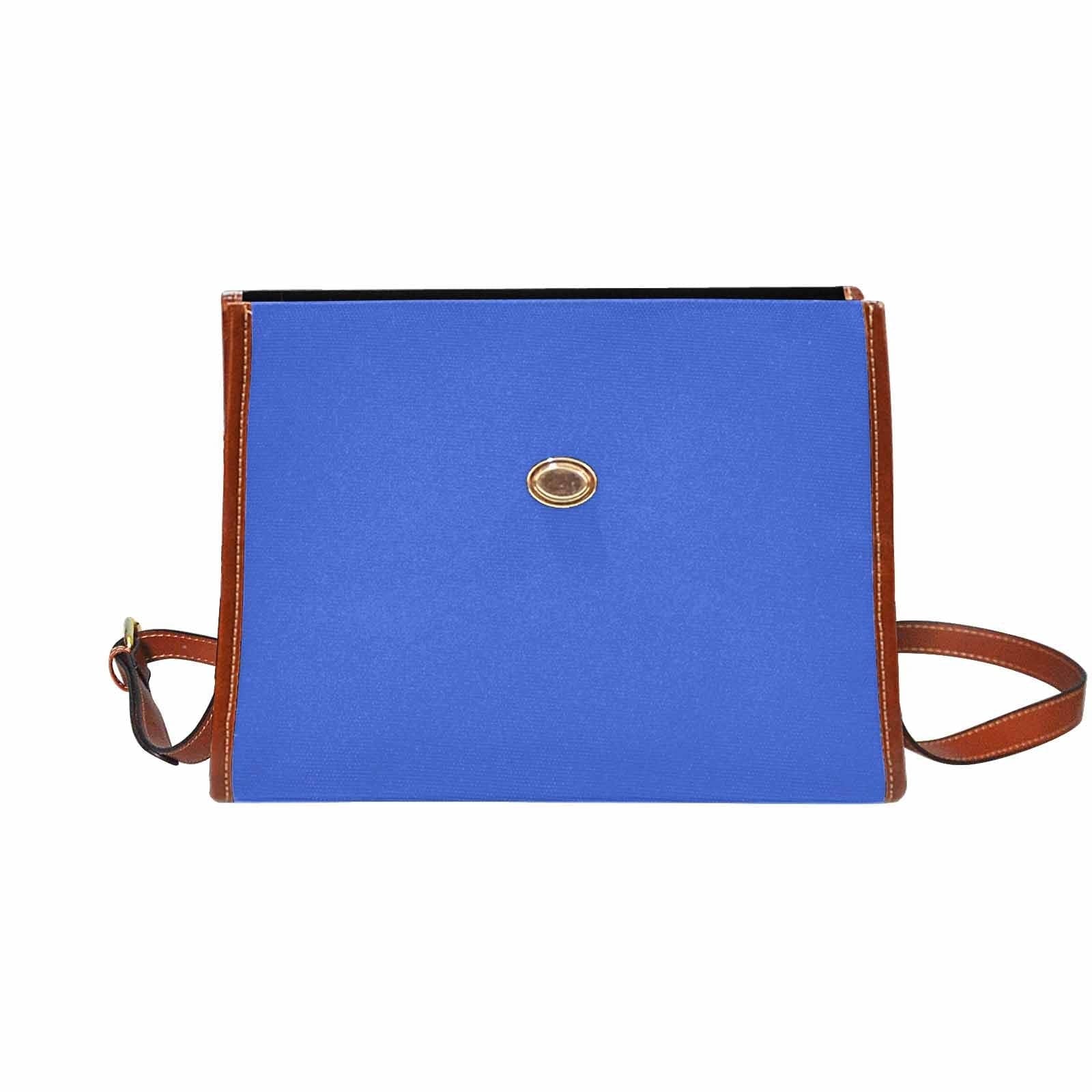 Royal Blue Canvas Handbag with brown crossbody strap, showcasing its waterproof material and stylish design.