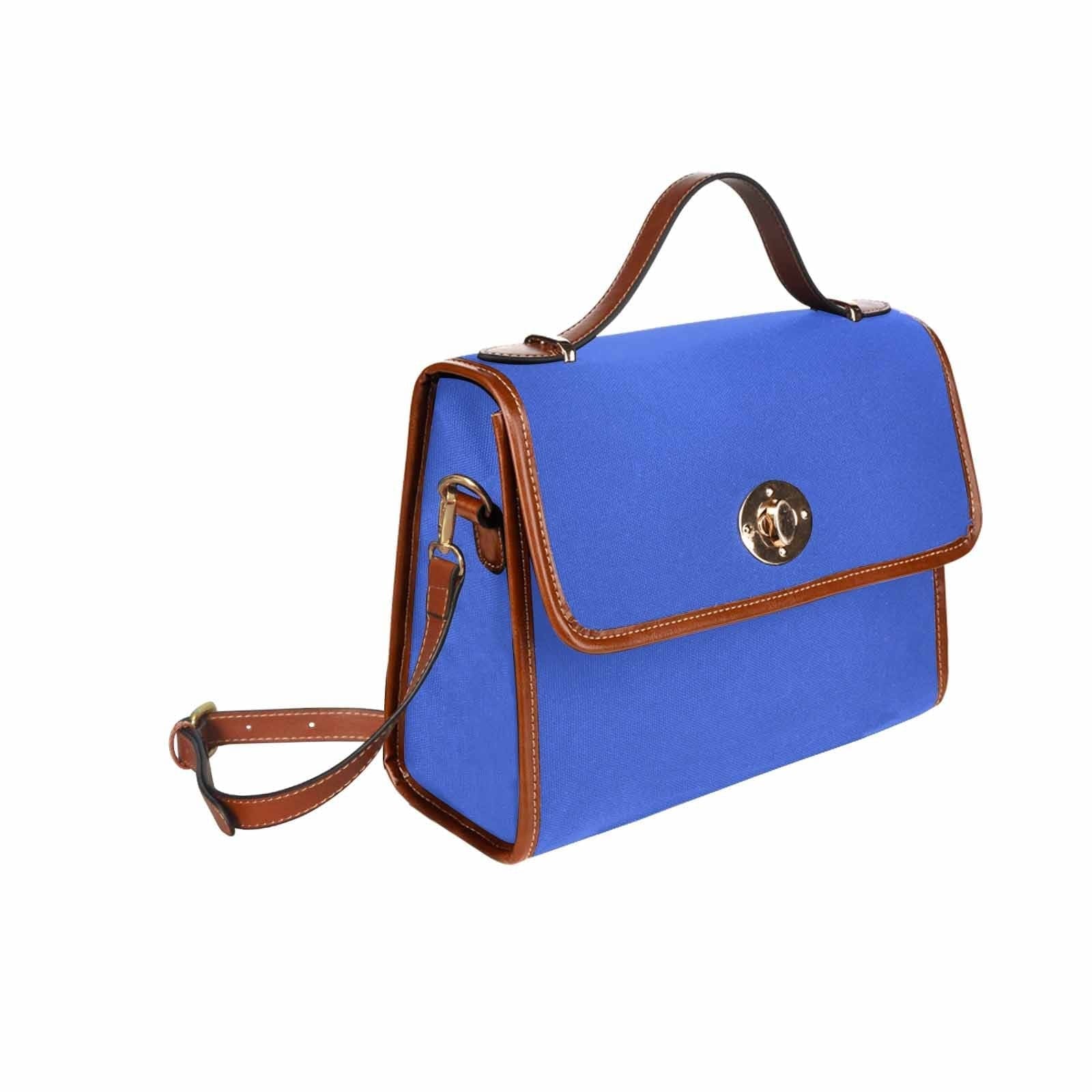 Royal Blue Canvas Handbag with brown crossbody strap, showcasing its waterproof material and stylish design.