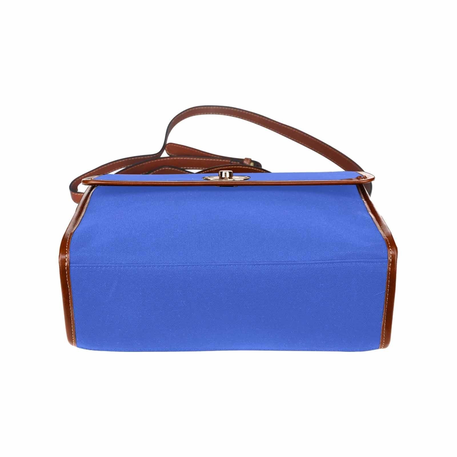 Royal Blue Canvas Handbag with brown crossbody strap, showcasing its waterproof material and stylish design.