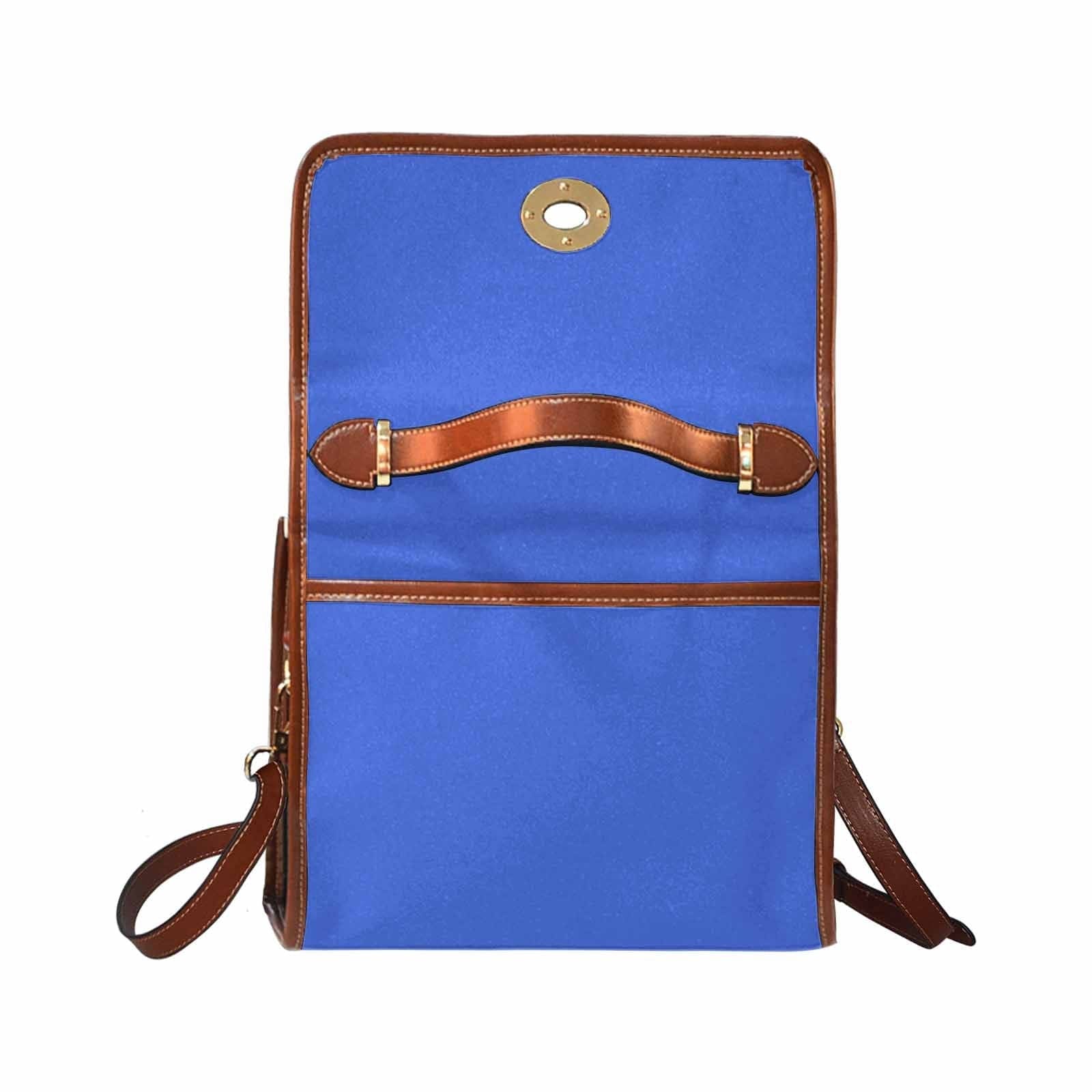 Royal Blue Canvas Handbag with brown crossbody strap, showcasing its waterproof material and stylish design.