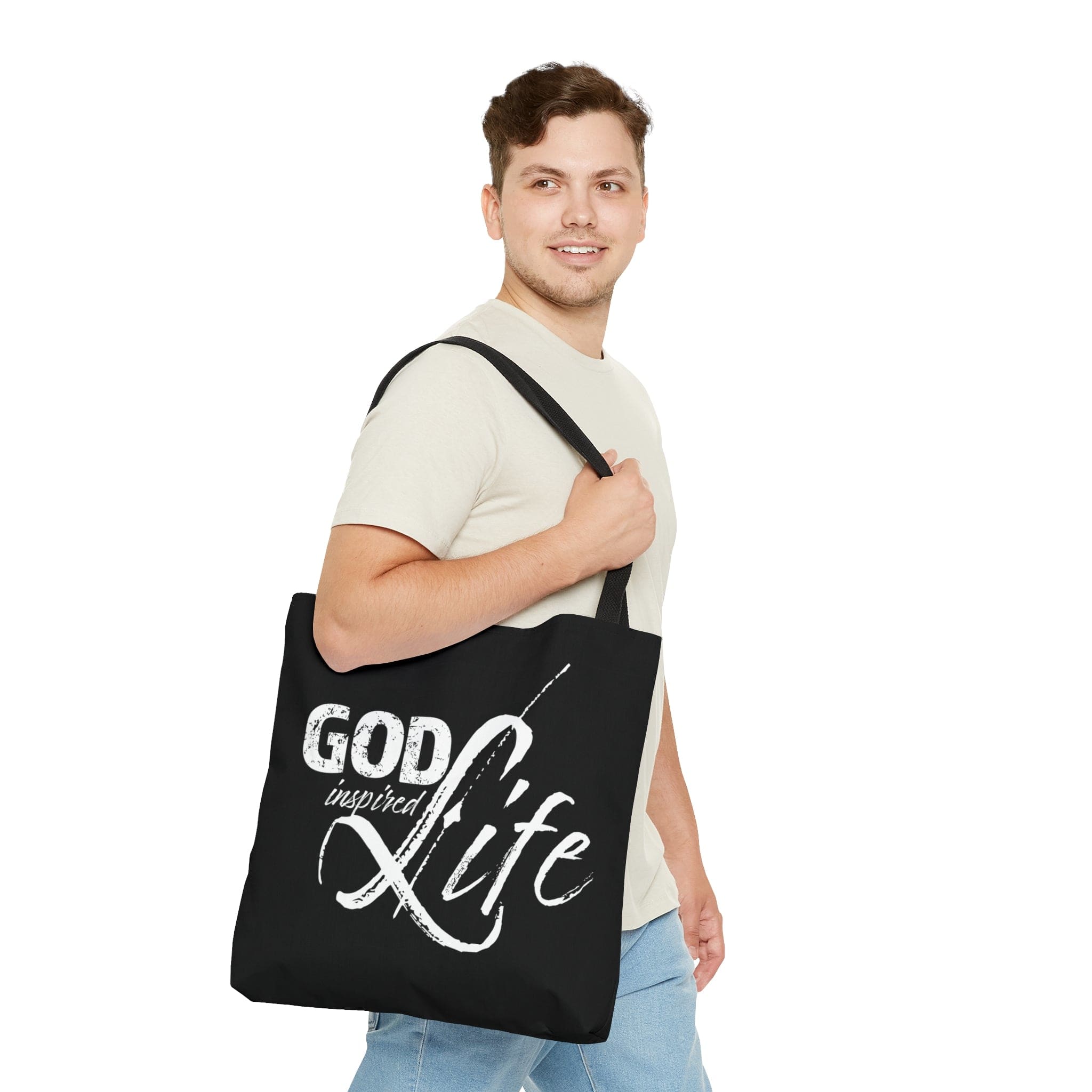 A stylish God Inspired Life Canvas Tote Bag featuring an inspirational quote, black cotton handles, and a chic design suitable for various occasions.