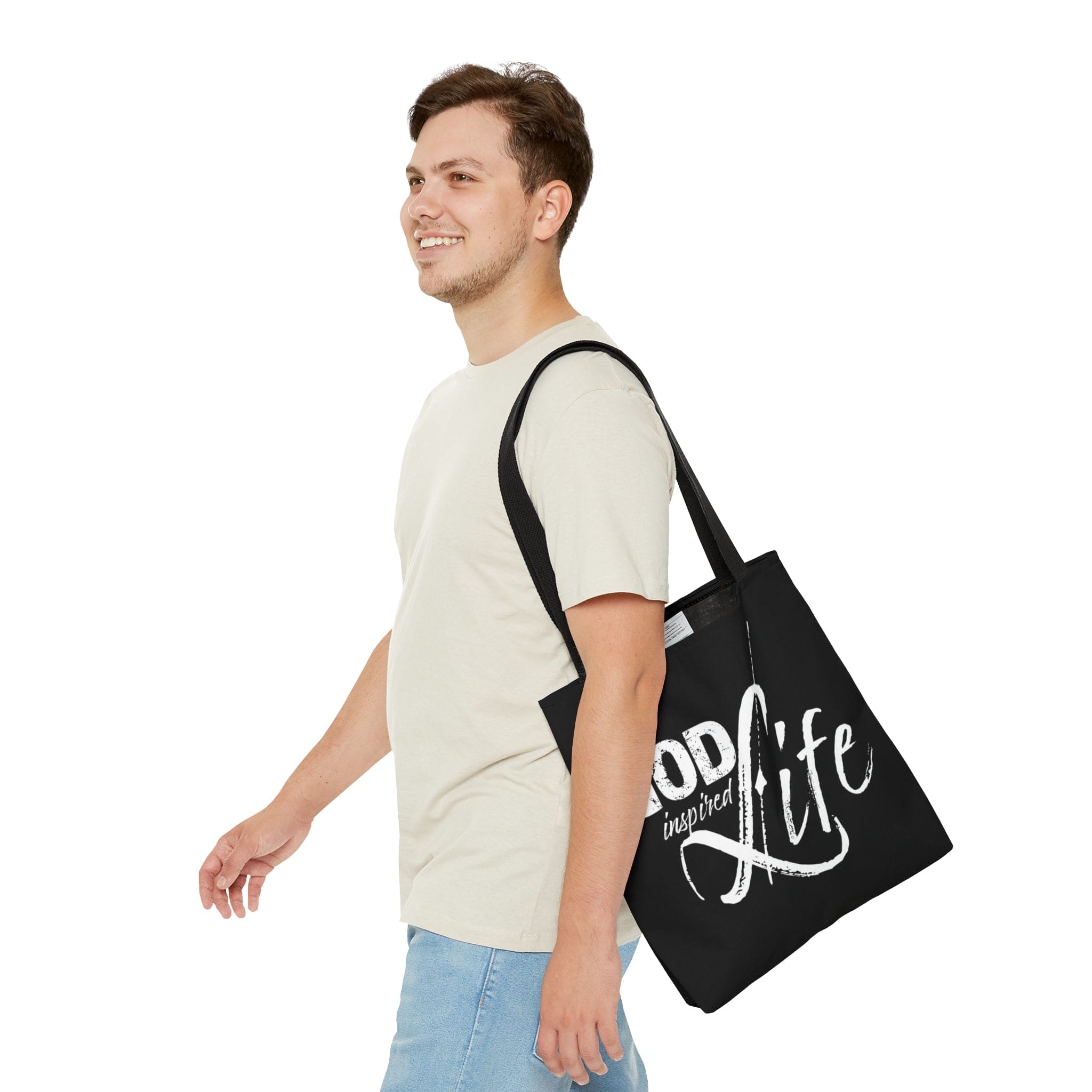 A stylish God Inspired Life Canvas Tote Bag featuring an inspirational quote, black cotton handles, and a chic design suitable for various occasions.