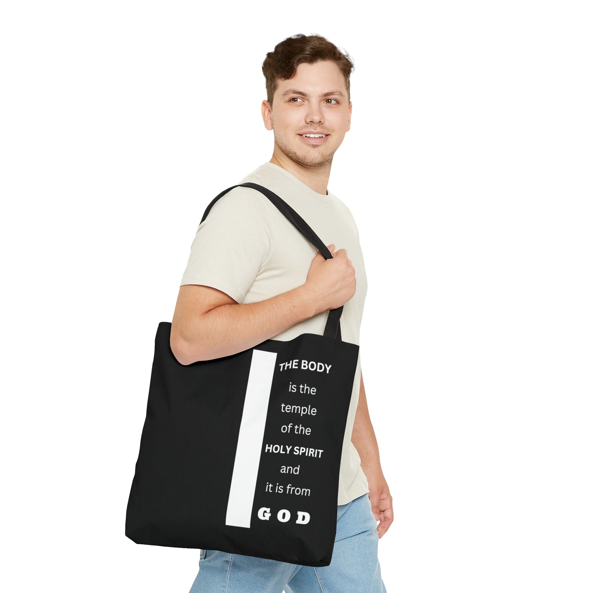 Canvas Tote Bag with scripture 'The Body is the Temple of the Holy Spirit', featuring a stylish all-over print and black cotton handles.